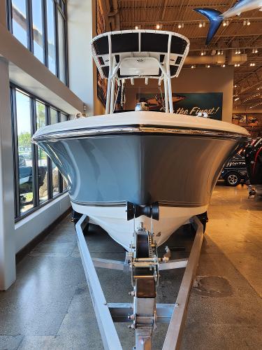 2025 Mako 214 CC boat displayed indoors on a trailer.