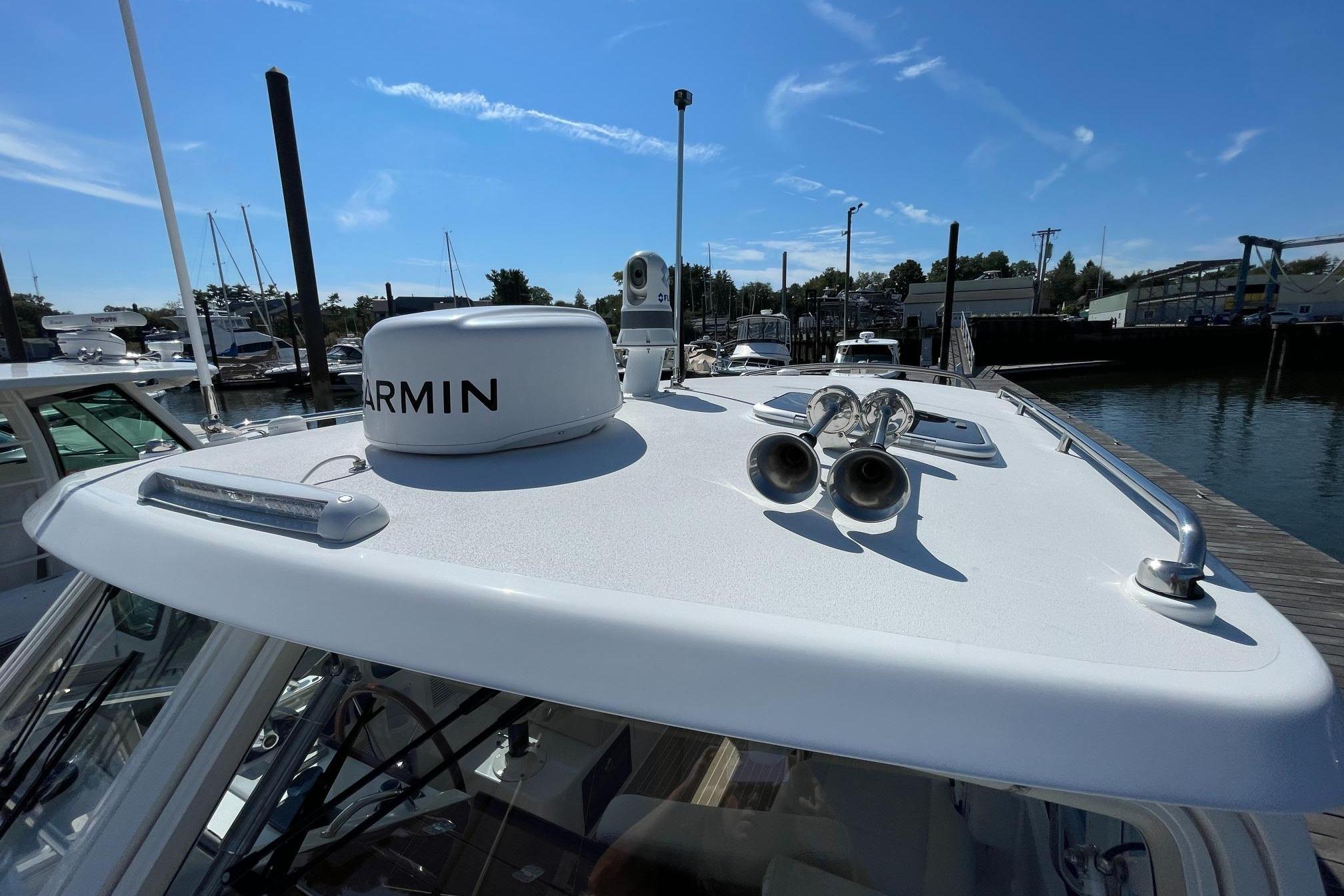 2023 MJM 35 boat with Garmin radar and dual horns at marina.