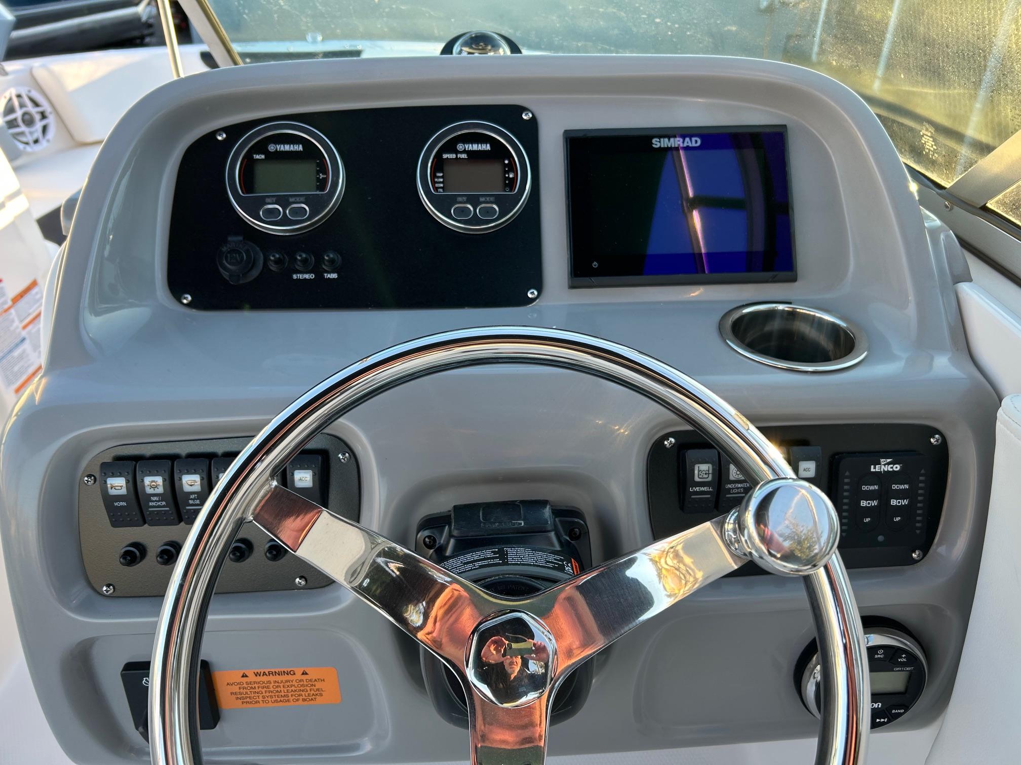 2026 Robalo R207 Dual Console dashboard with steering wheel, gauges, and Simrad display.