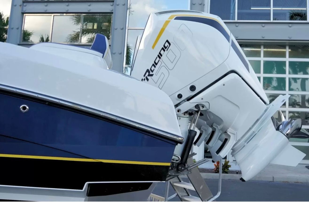 Outboard motor of a boat with modern design and blue accents.