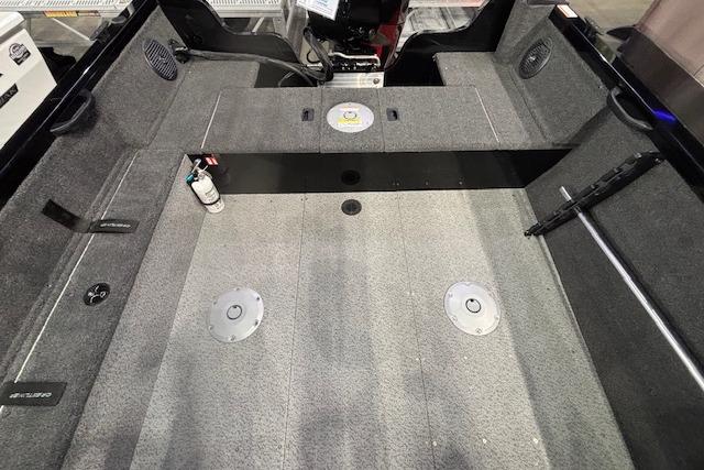 Interior view of 2026 Crestliner 1850 Kodiak WT boat, featuring spacious carpeted deck.