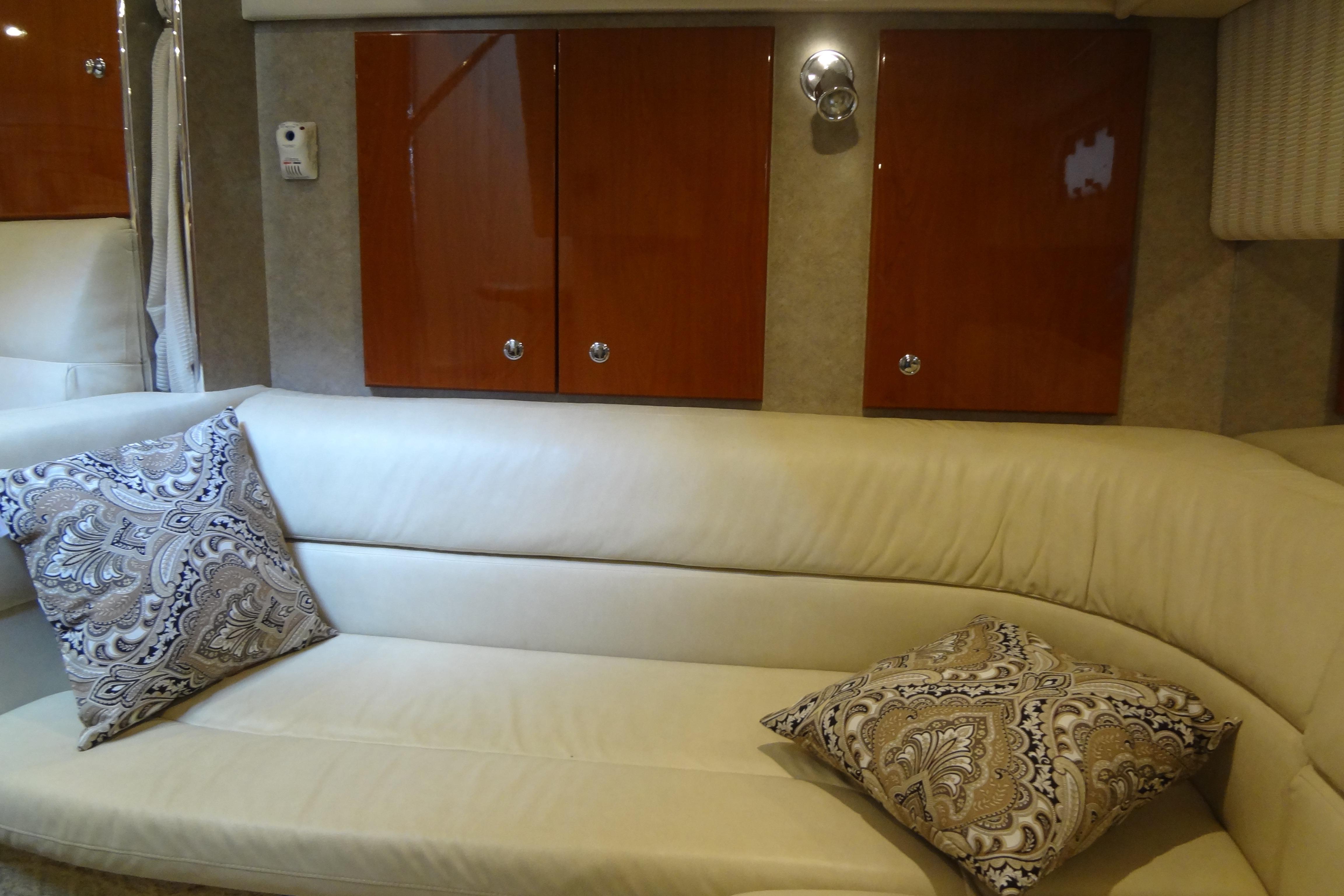 Luxurious interior of 2007 Formula 34 Performance Cruiser with elegant seating and decorative pillows.