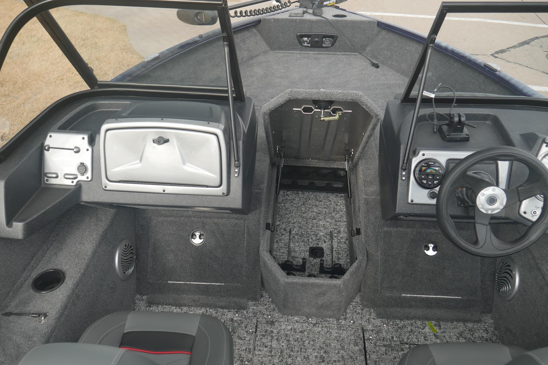 Interior of 2026 Tracker Pro Guide V-175 Combo boat, featuring steering wheel and storage compartments.
