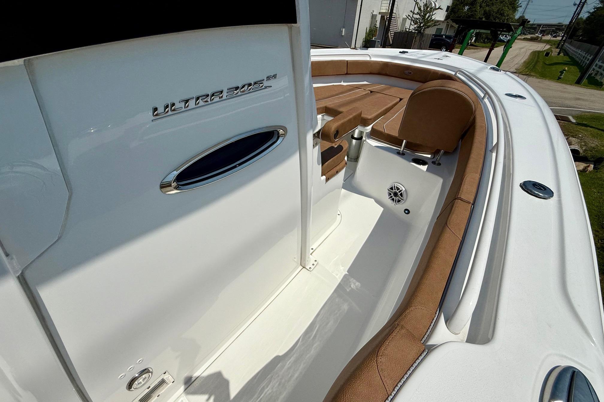 2026 Sea Hunt Ultra 305 SE boat interior with tan seating and sleek design.