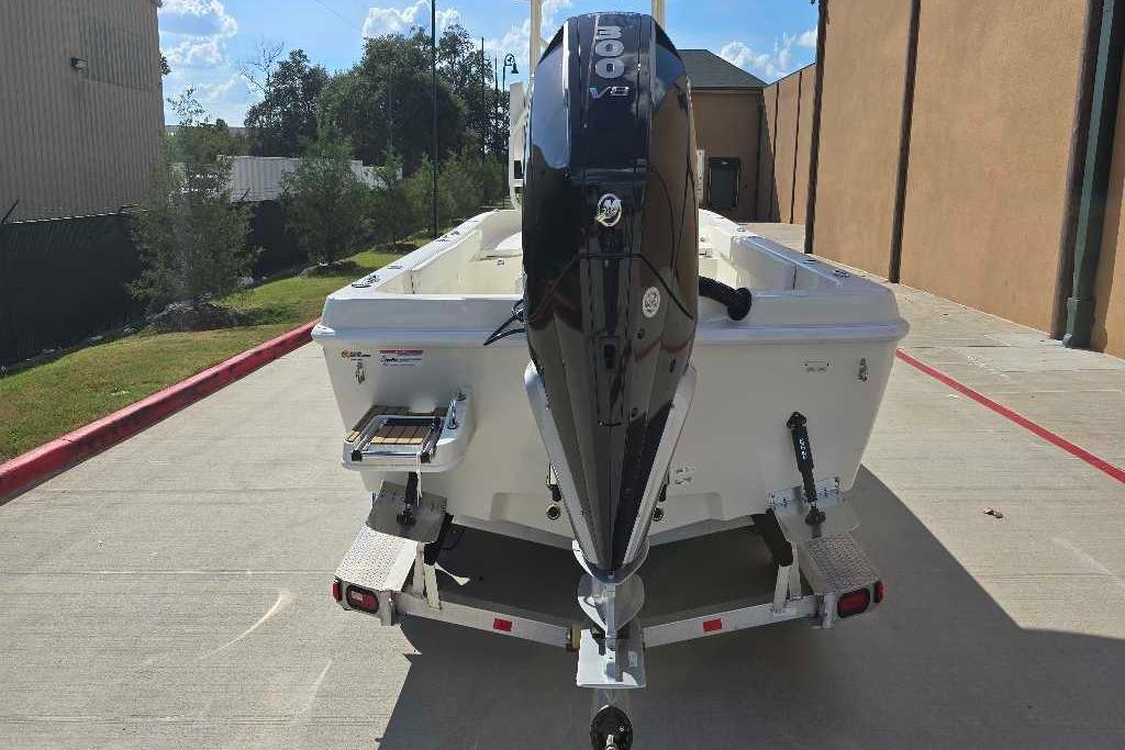 2025 Ranger 2360 Bay boat with powerful V8 engine, parked outdoors.