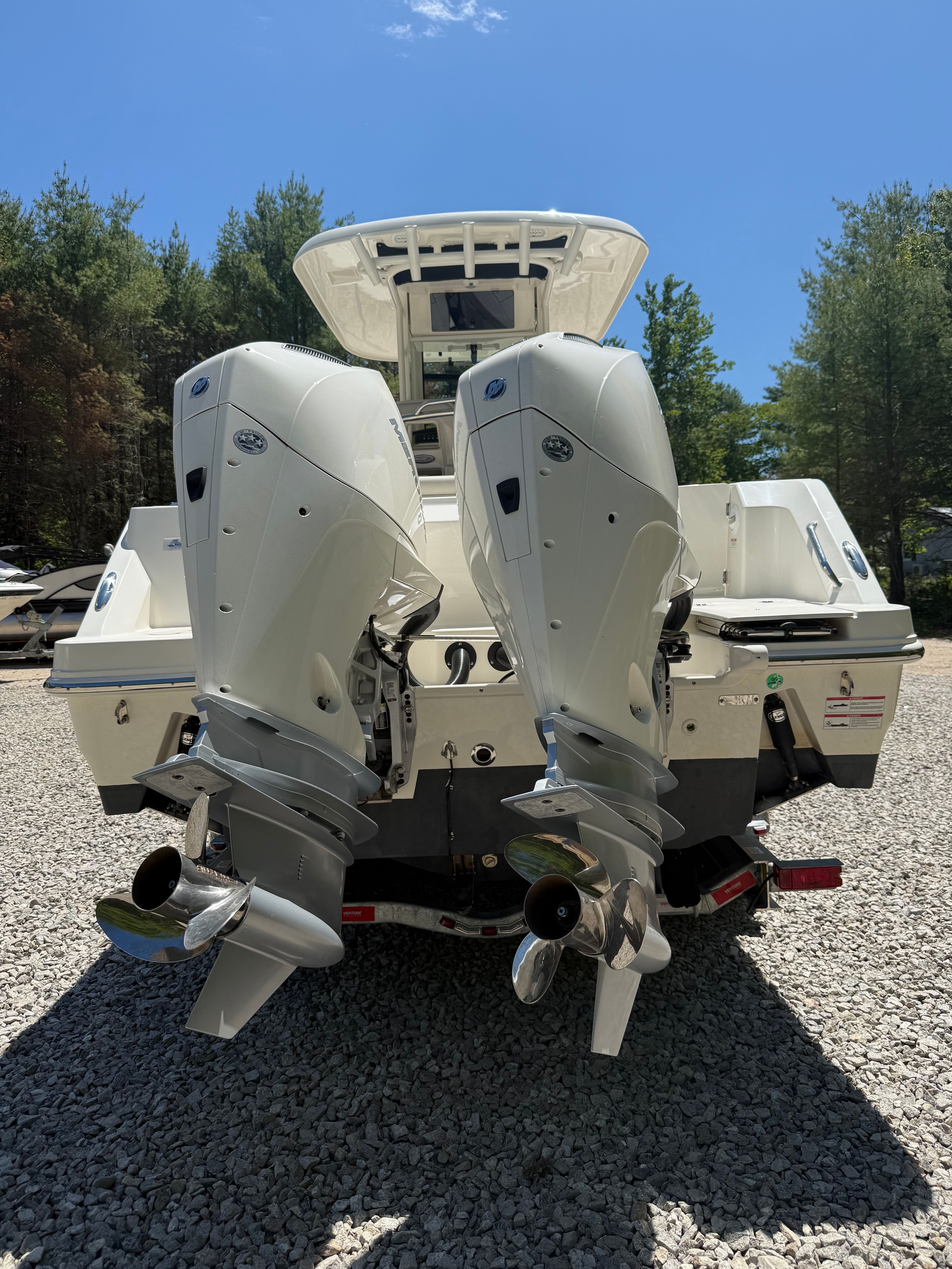 2024 Boston Whaler 250 Outrage with dual outboard engines.