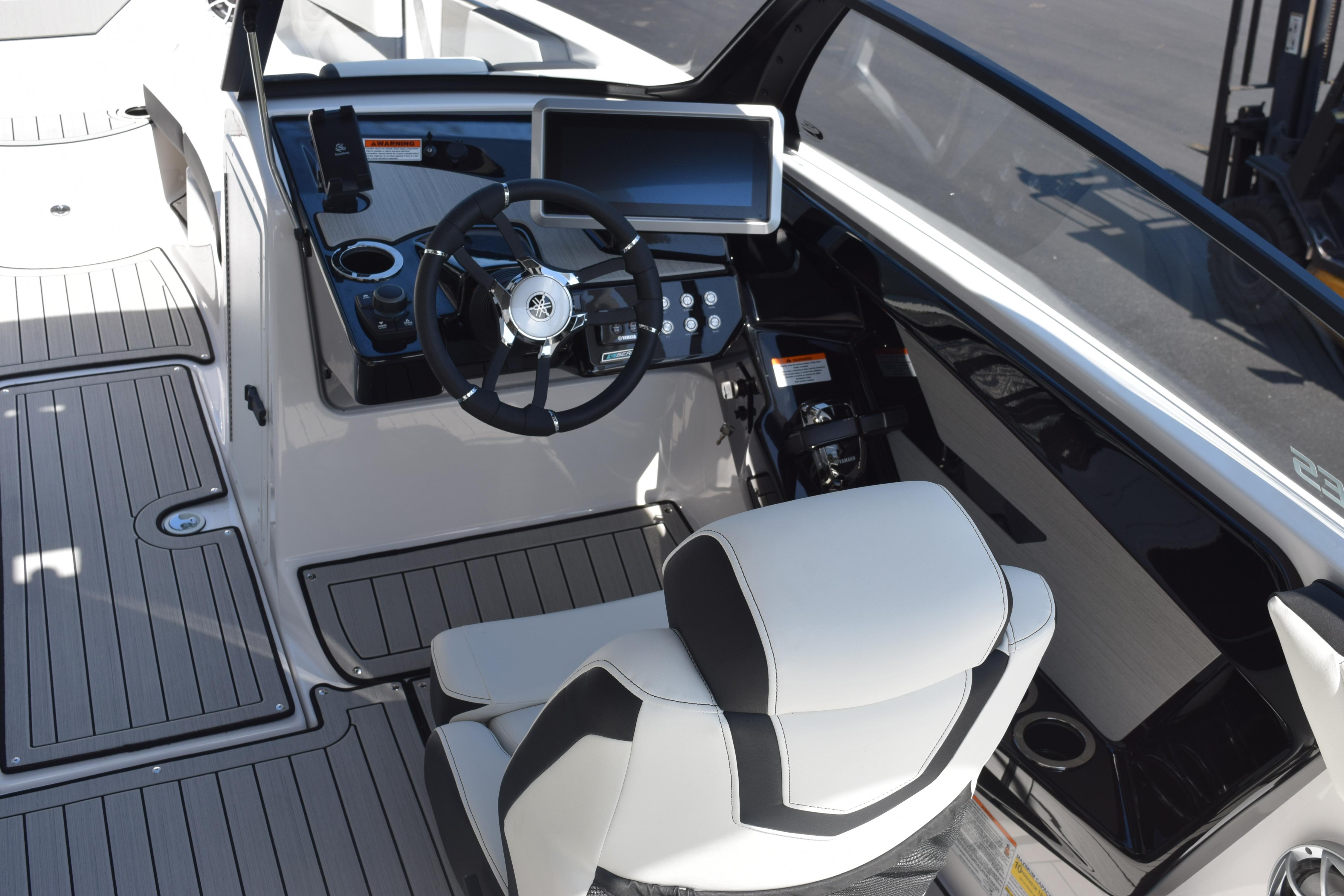 2026 Yamaha Boats 222SE cockpit with steering wheel and modern dashboard.