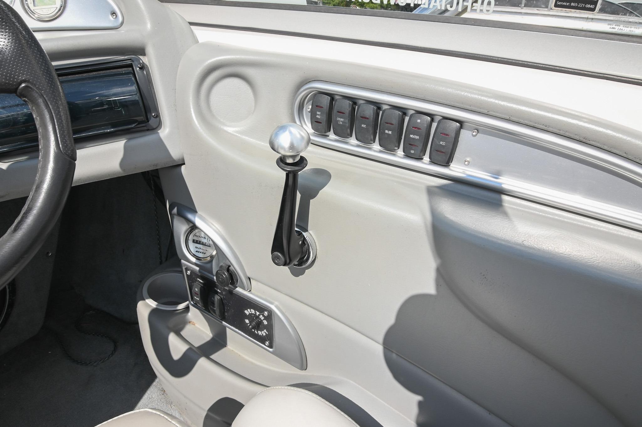 2004 Supra Launch SS interior dashboard with control switches and steering wheel.