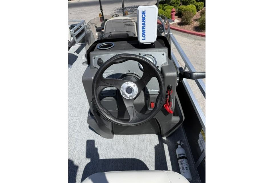 Steering console of 2026 Sun Tracker Bass Buggy 16 XL Select with Lowrance device.