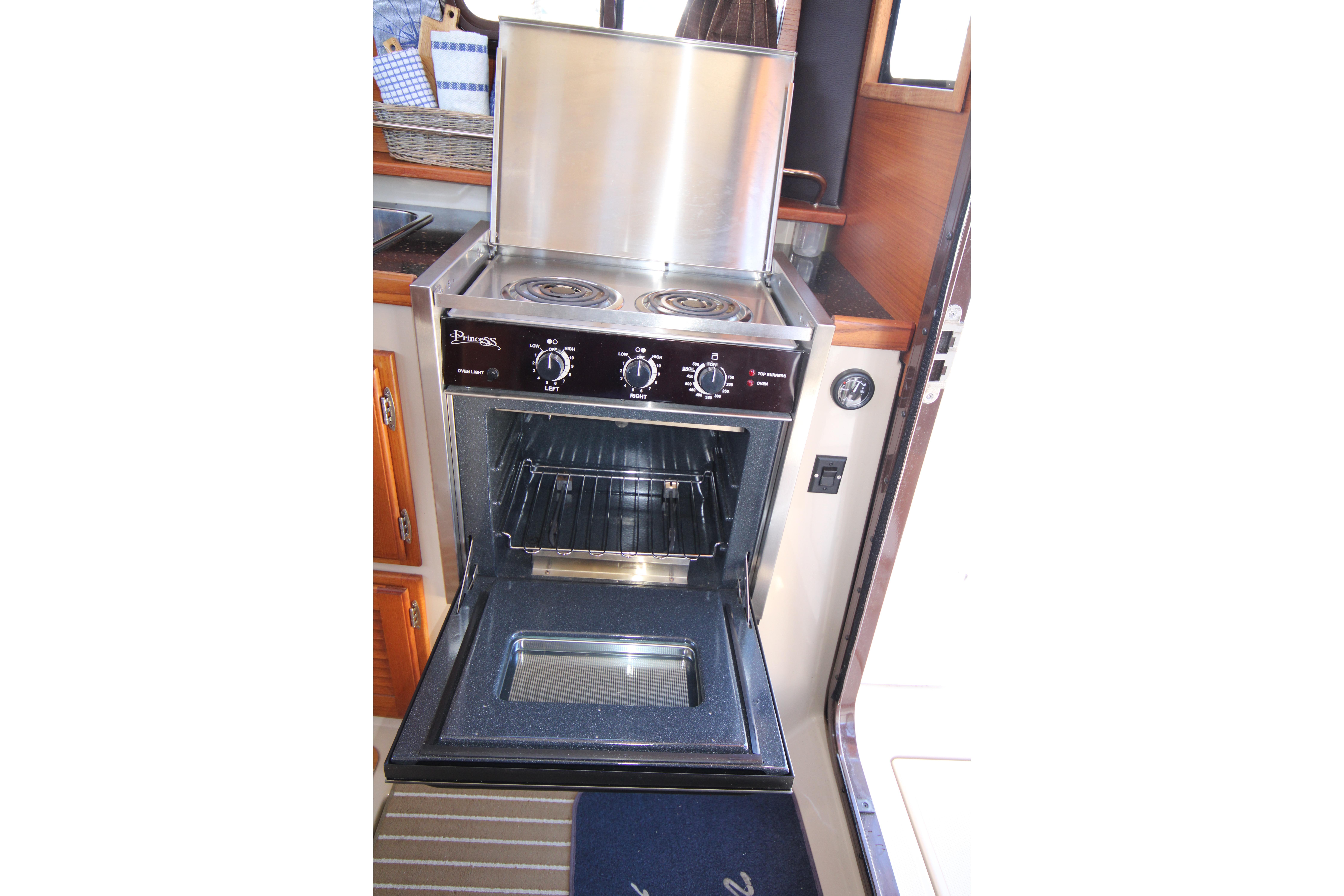 Stove and oven inside a 2013 Ranger Tugs R-31 CB boat galley.