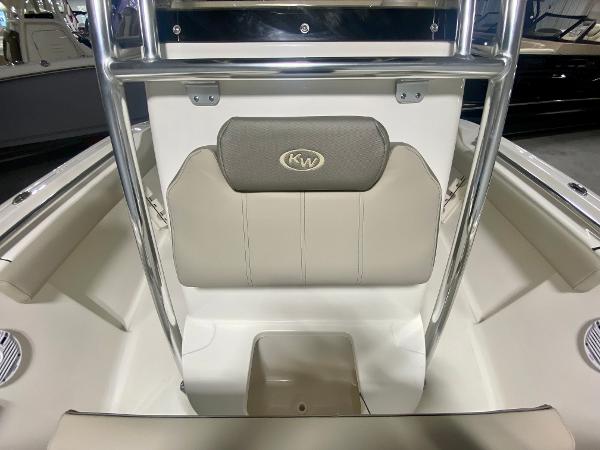 2024 Key West 219 FS boat interior with cushioned seating and storage.