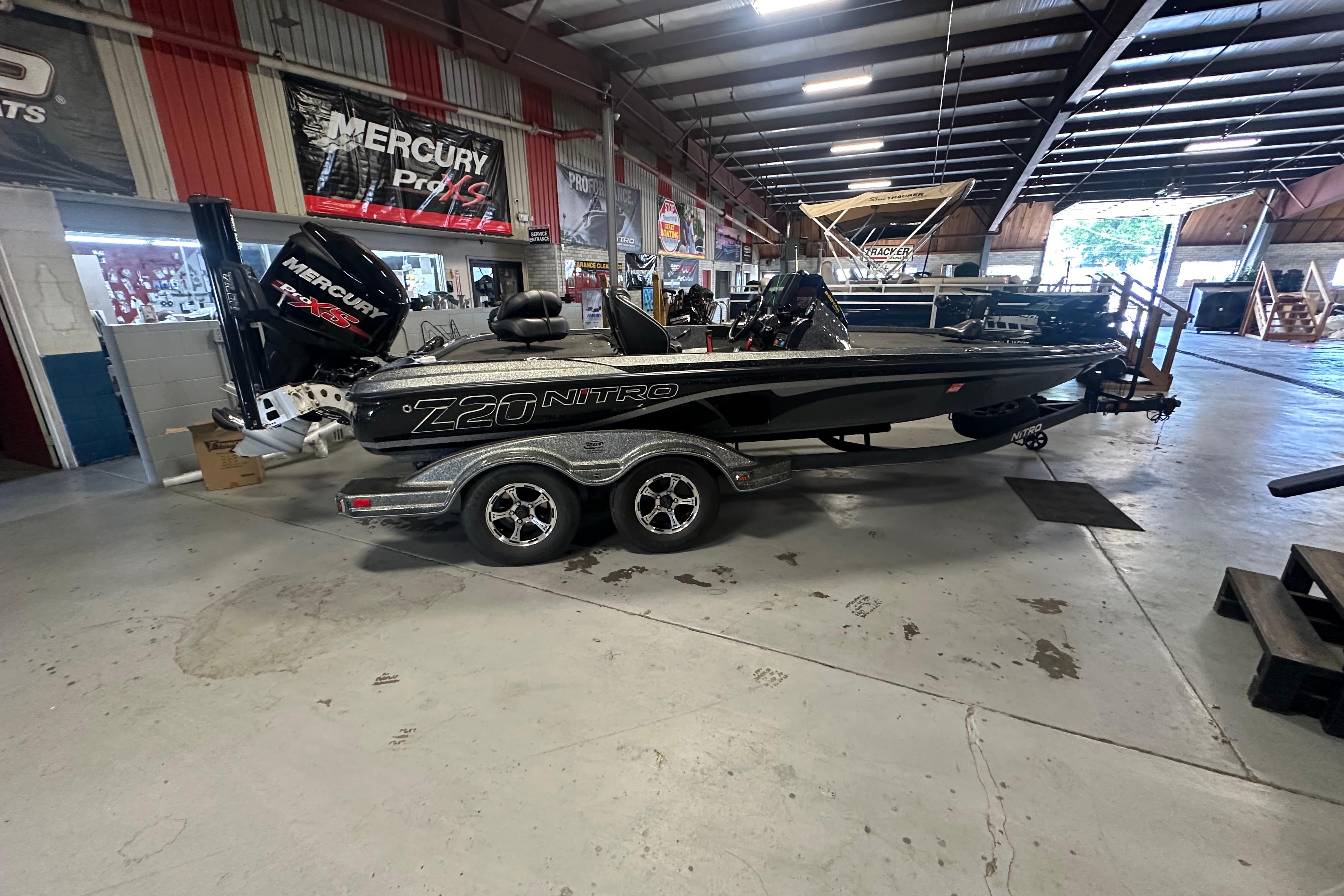 2018 Nitro Z20 Pro boat in showroom with Mercury engine.