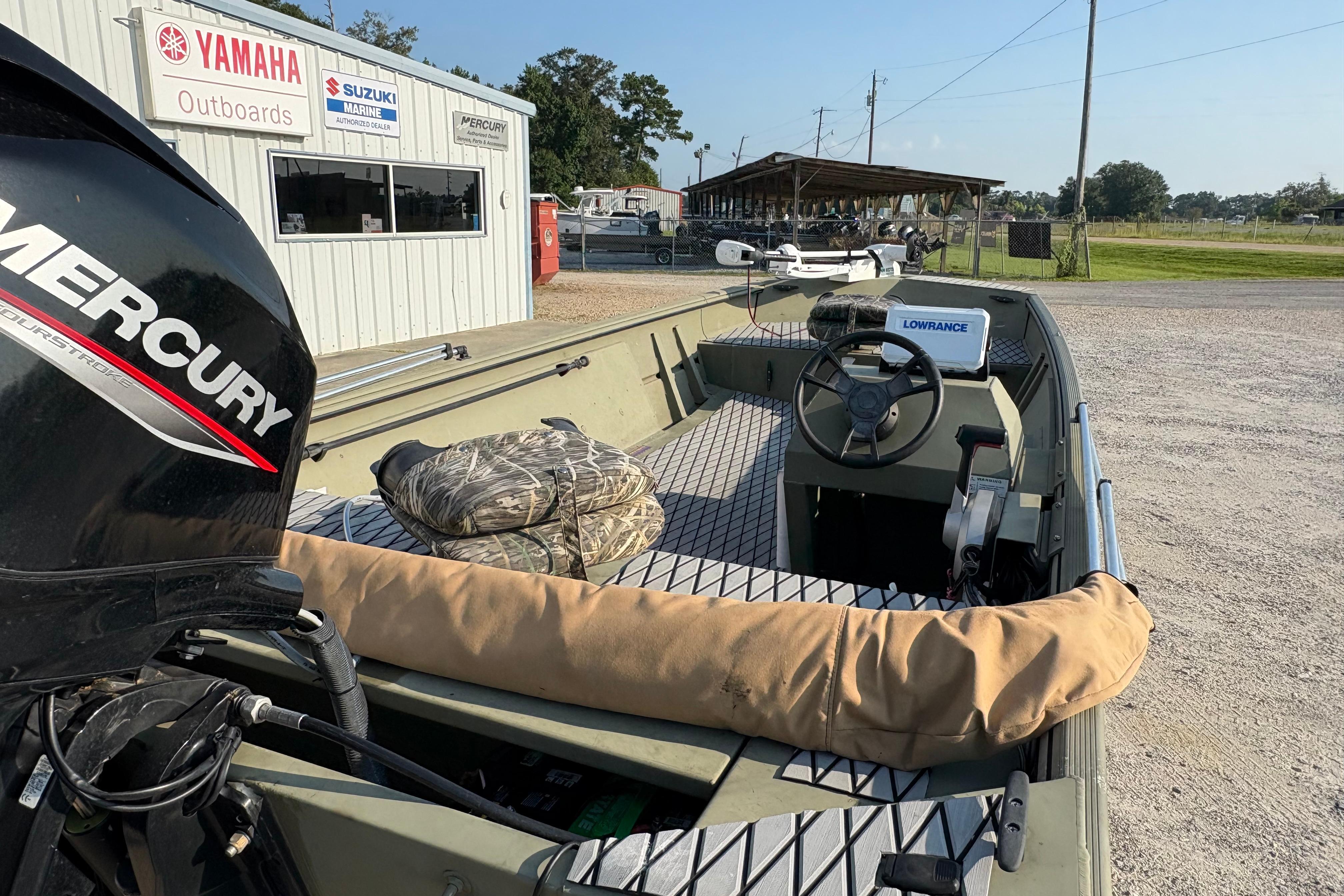 2019 Lowe Roughneck 1860SC boat with Mercury engine at dealership.