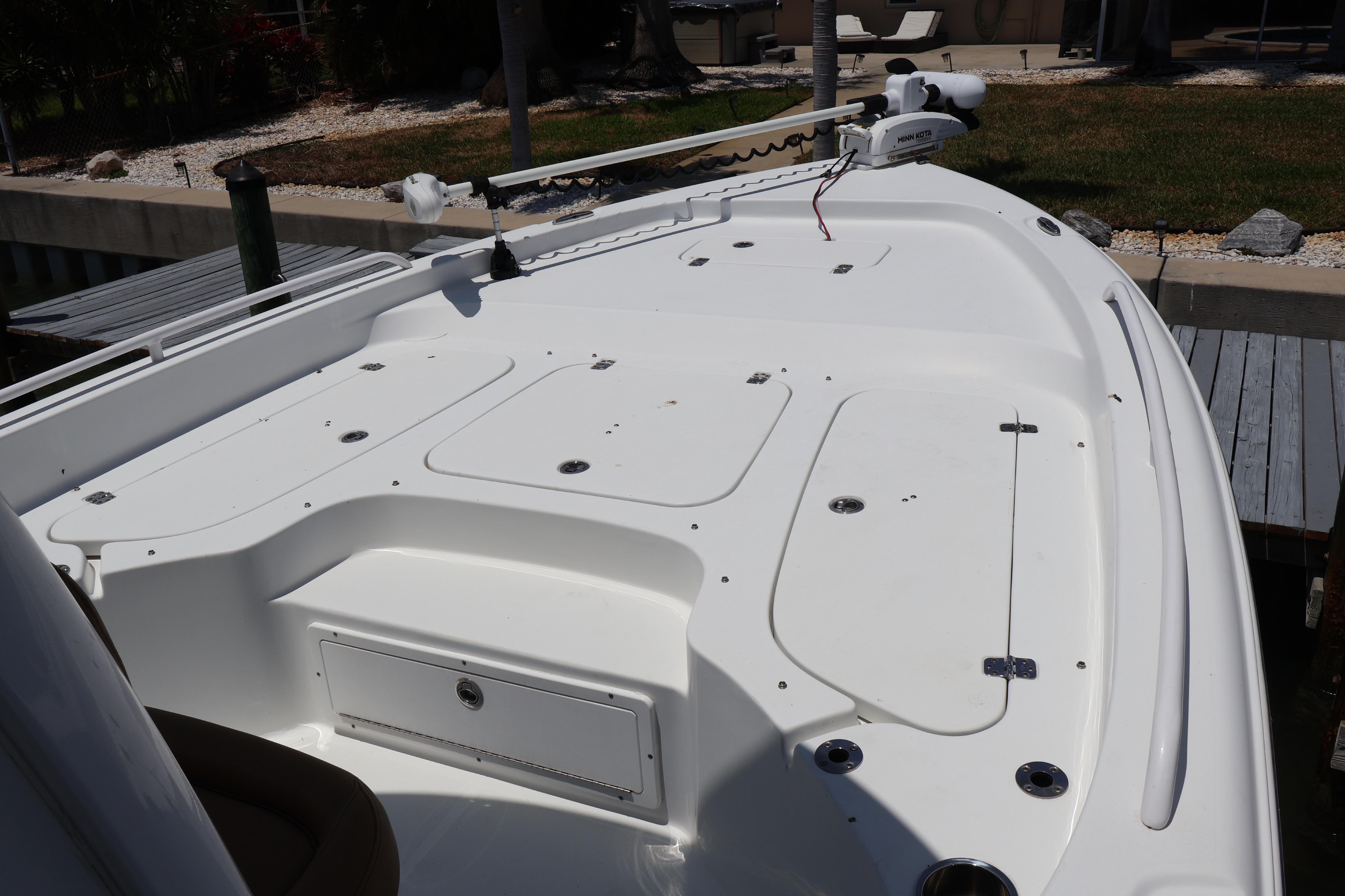 2022 Sea Hunt BX 25 FS boat deck with storage compartments and trolling motor.
