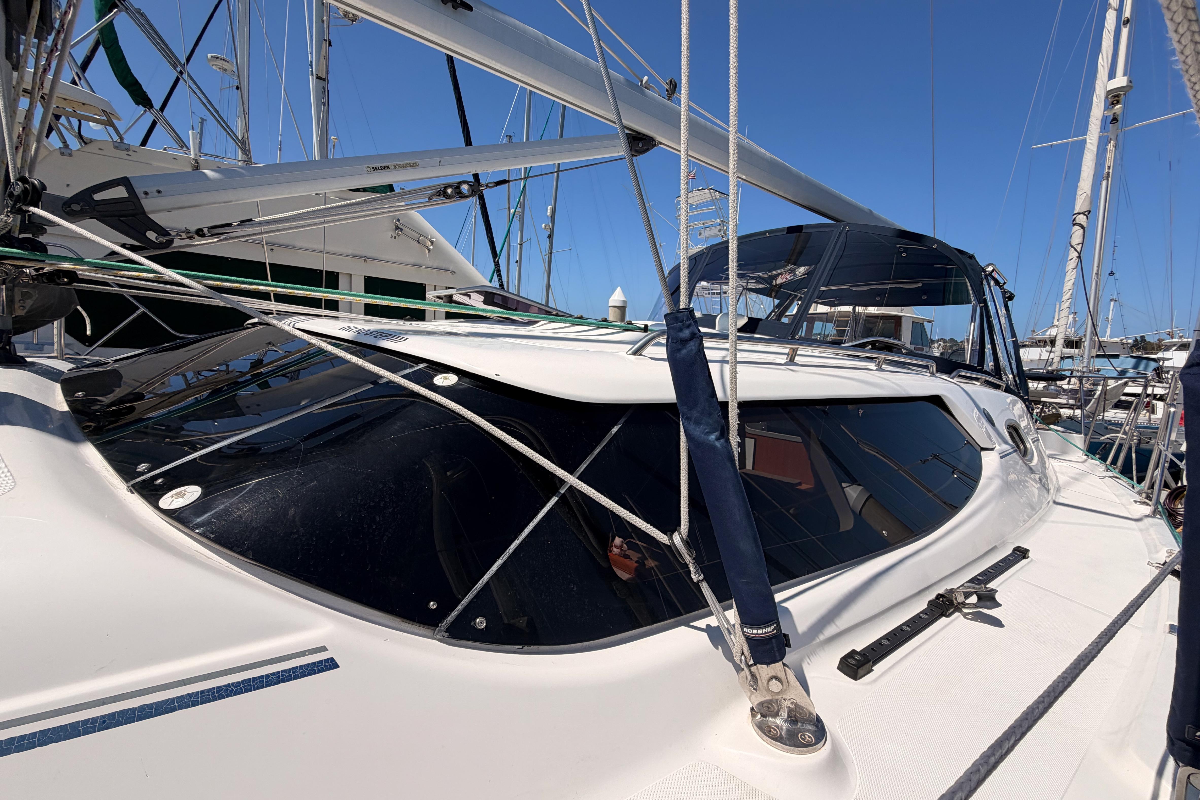 2008 Hunter 45 Deck Salon sailboat with sleek design and rigging, docked in marina.