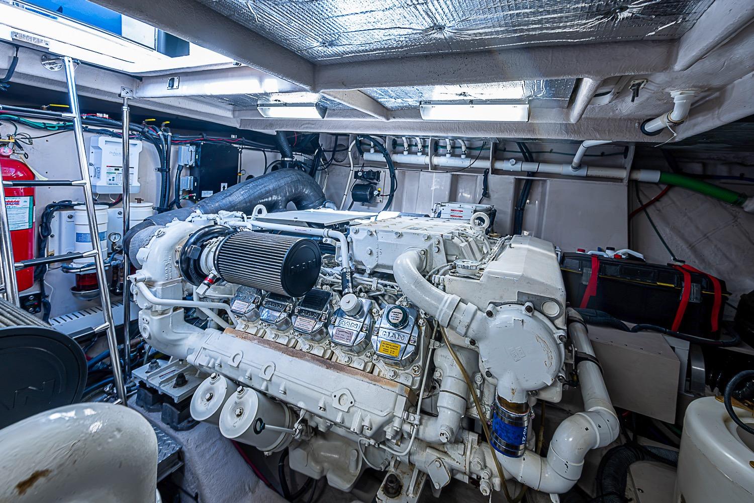 Engine room of a 2008 Sea Ray 60 Sundancer yacht, showcasing detailed machinery.