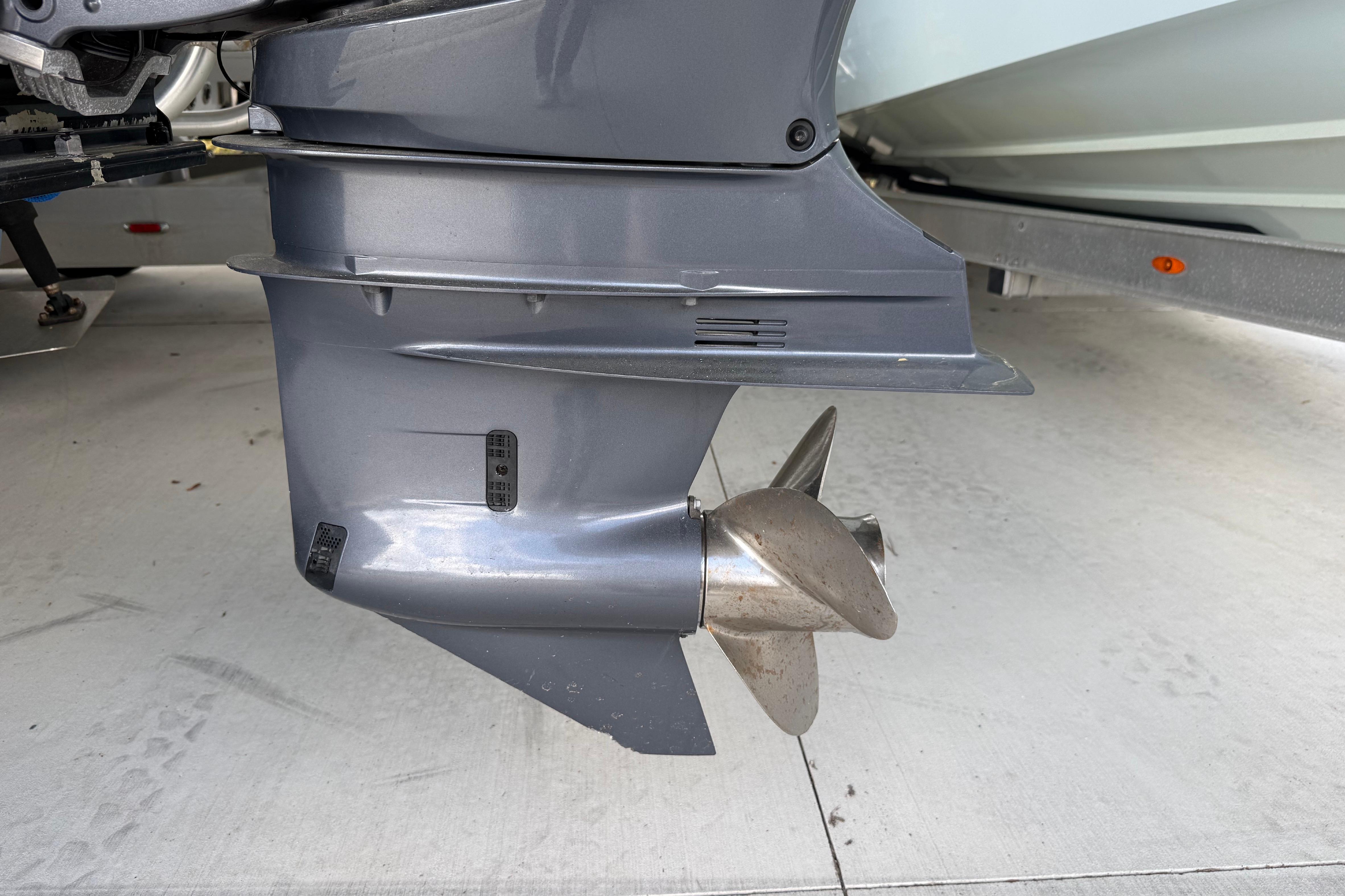 Outboard motor propeller of a 1974 Aquasport 2400 Center Console boat.
