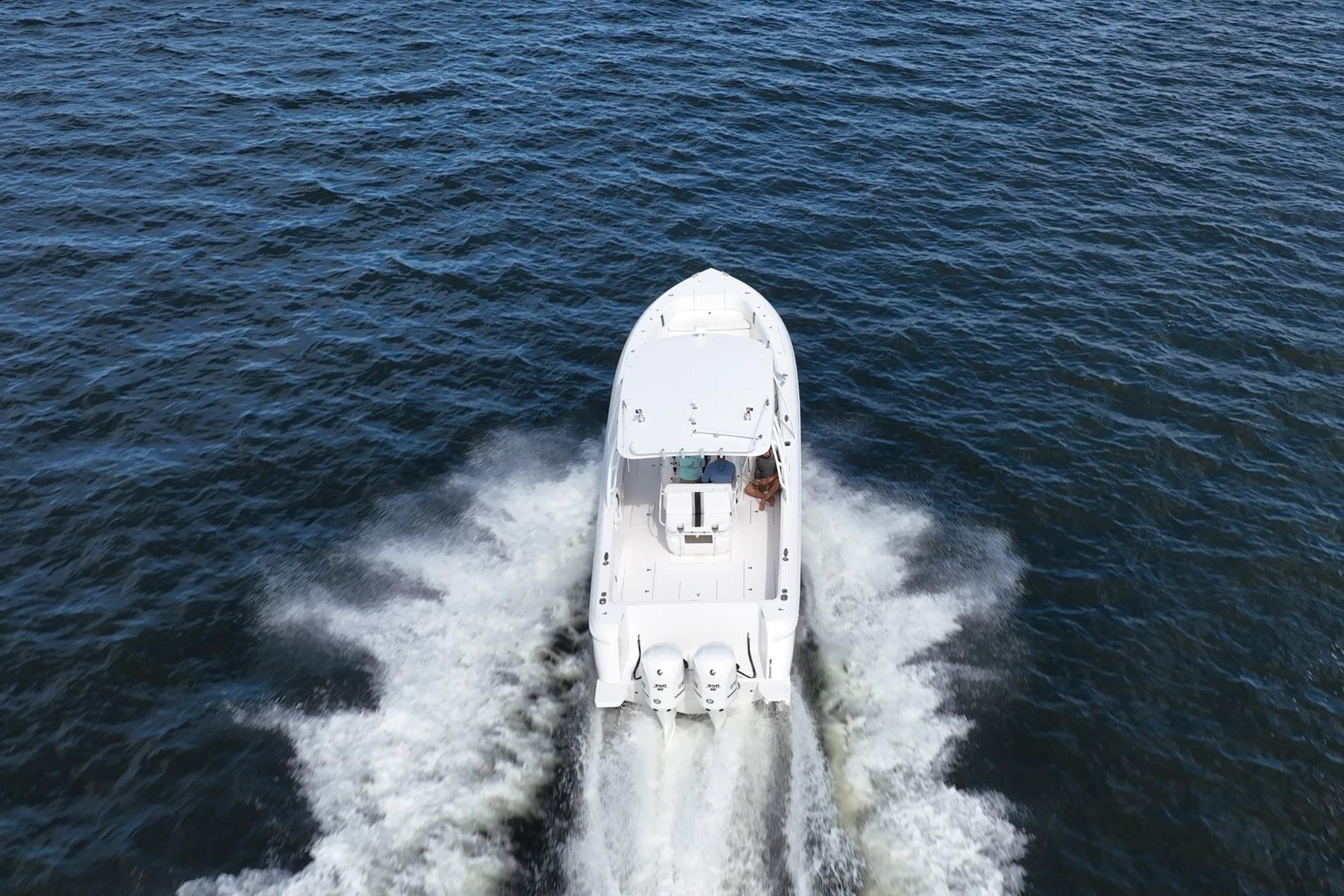 2011 Intrepid 400 Center Console boat cruising on open water, aerial view.