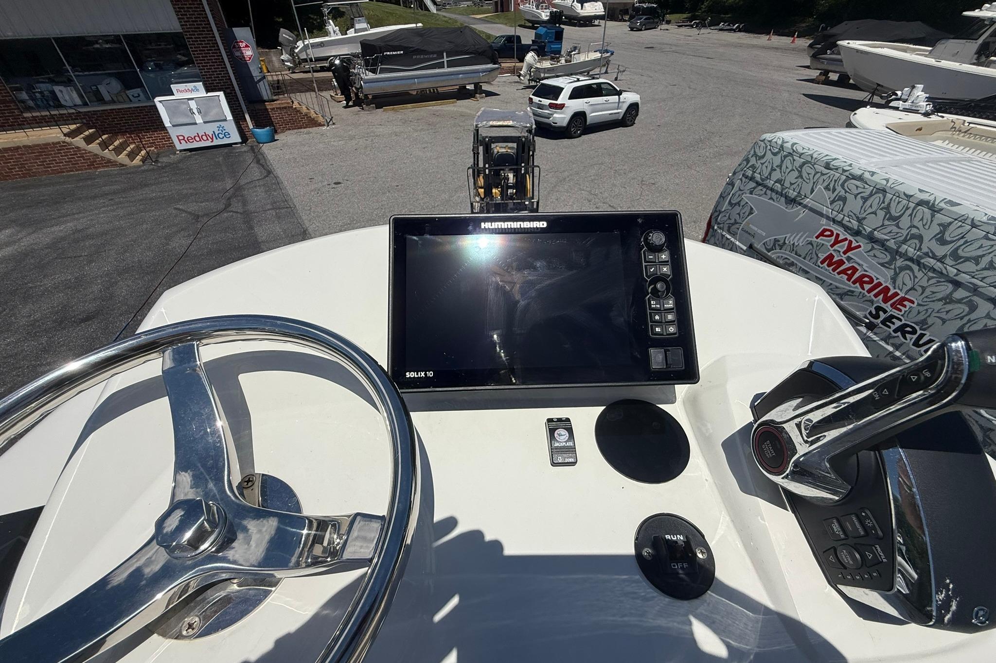 Helm of 2024 Pair Customs 24 Center Console MV with navigation display and controls.