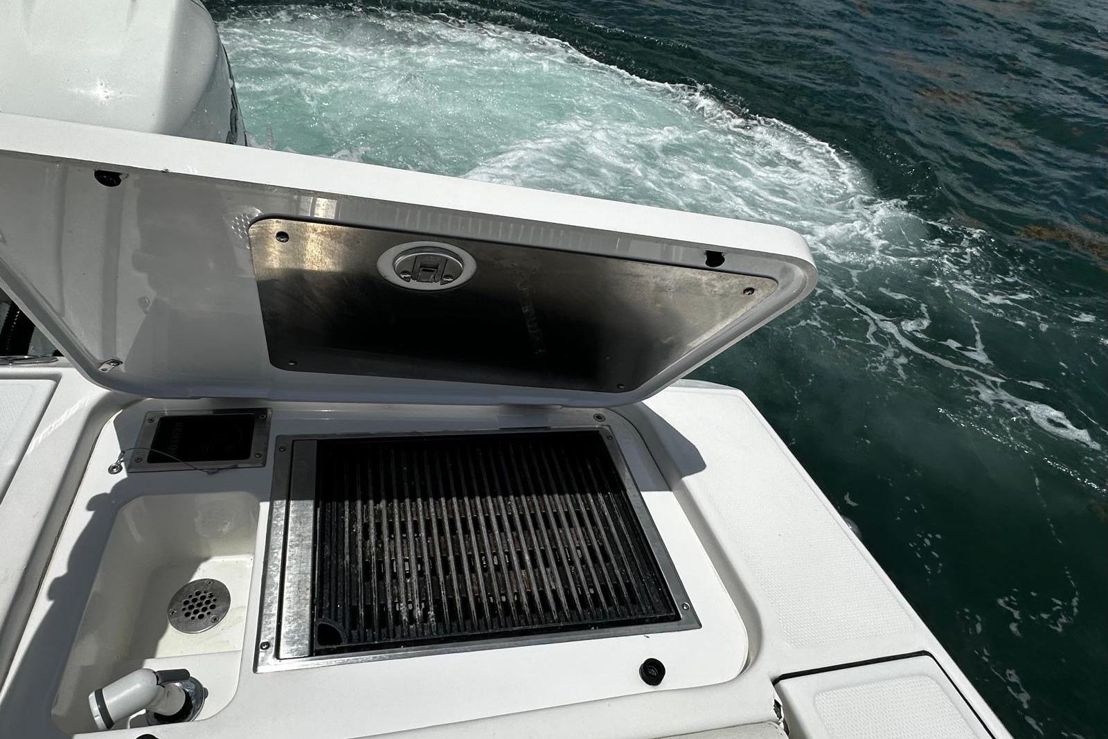 2022 Bertram 39 CC boat with open grill and ocean view.