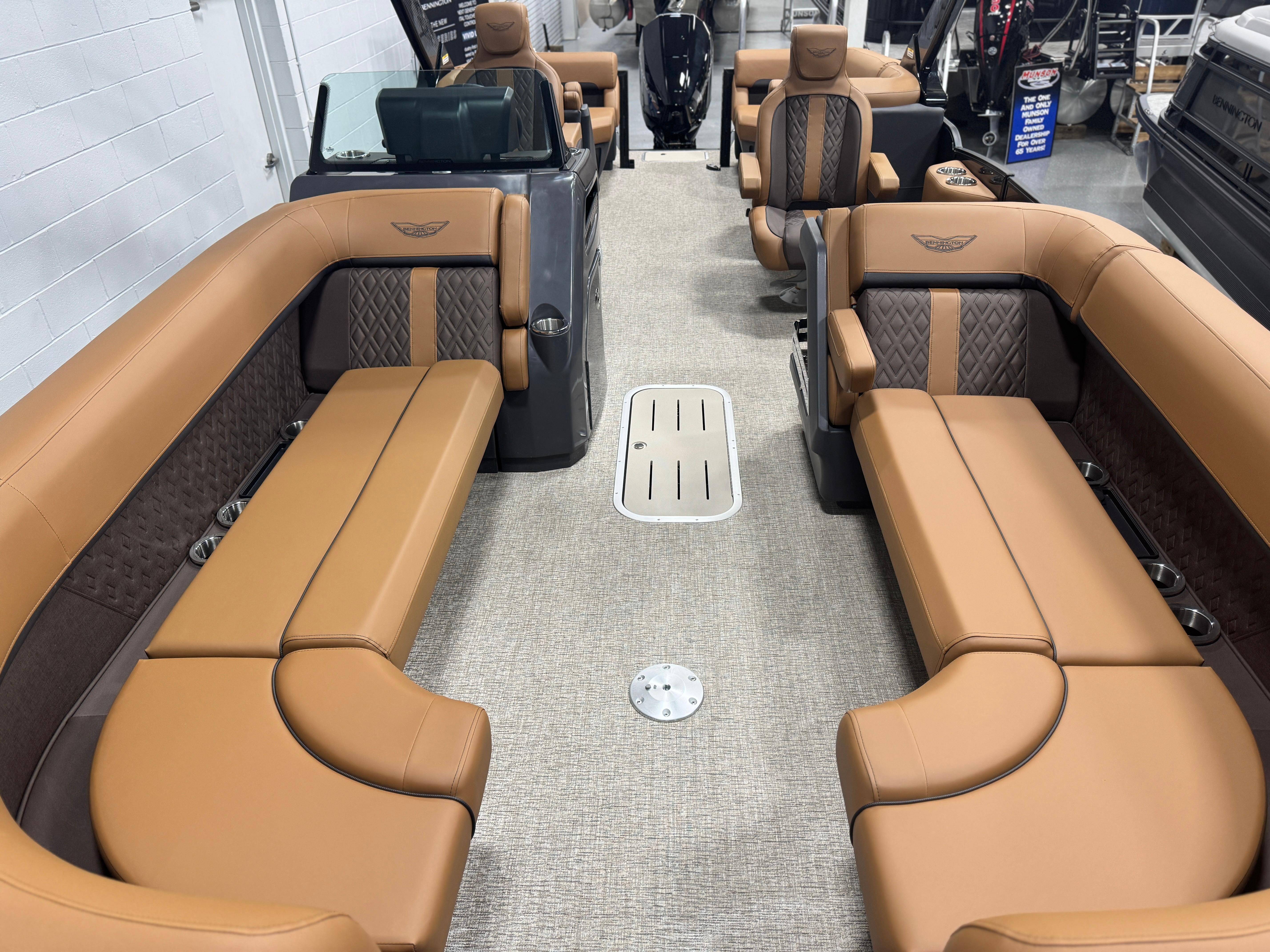 2025 Bennington 24 MFB boat interior with luxurious tan seating and modern design.