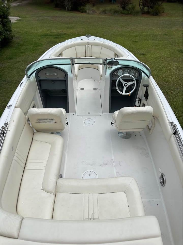 2001 Chris-Craft Launch 22 boat interior with white seating and steering wheel.