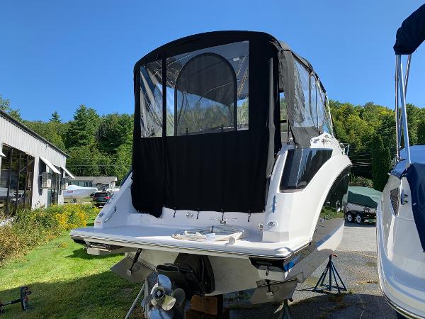 The image shows a 2017 Regal 26 Express boat with a black canopy on land.