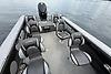 2023 Lund 1975 Tyee boat interior with seating, on calm water.