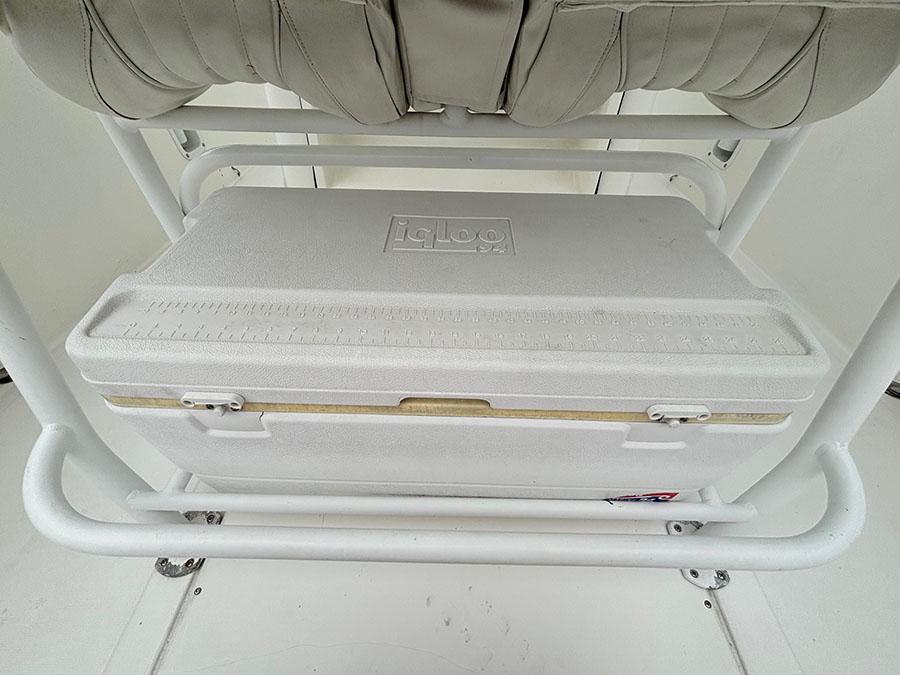 White Igloo cooler on Marlago FS35 boat, 2003 model, under cushioned seat.