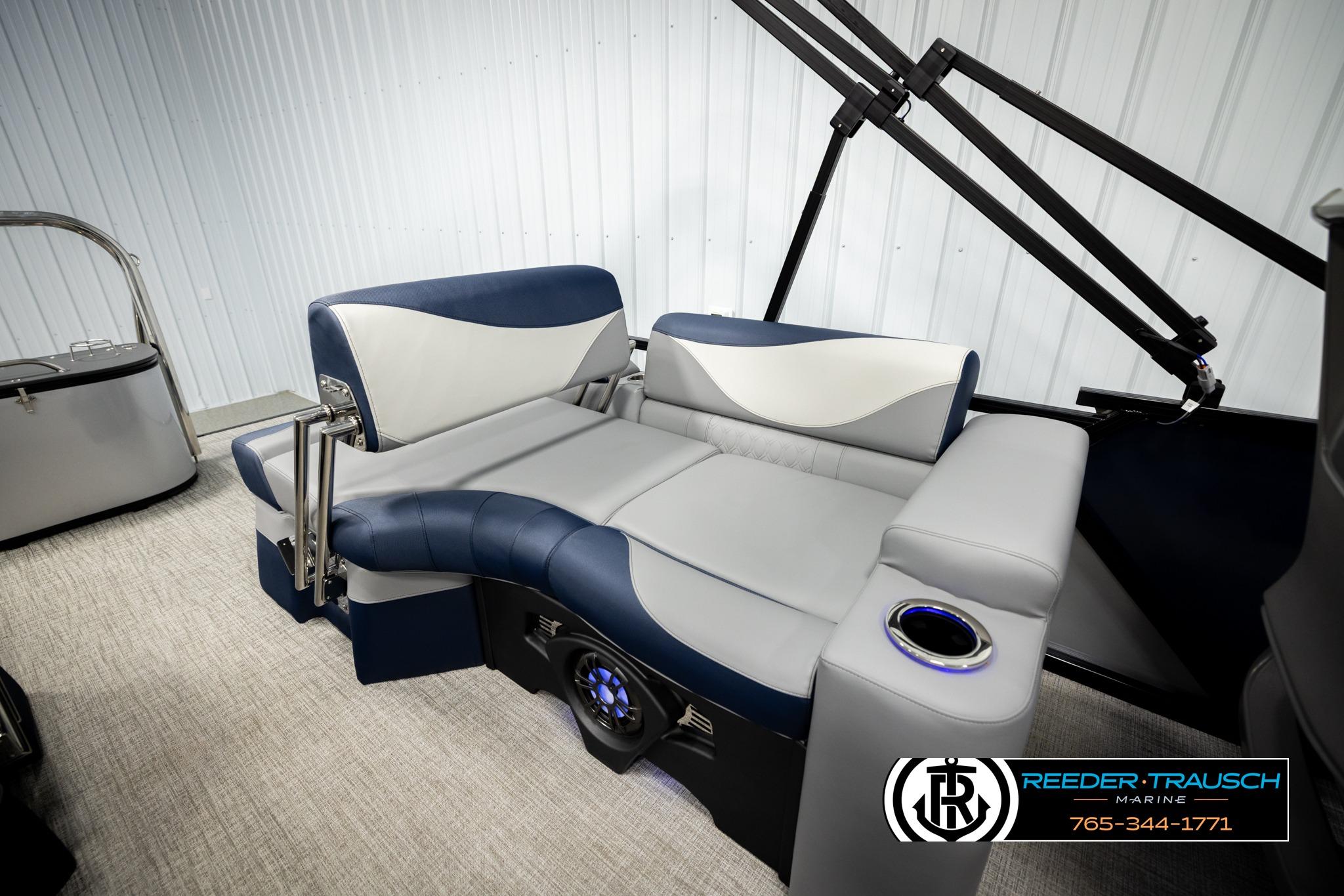 2026 Avalon LSZ QLS boat interior with blue and gray seating, cup holder, and modern design.