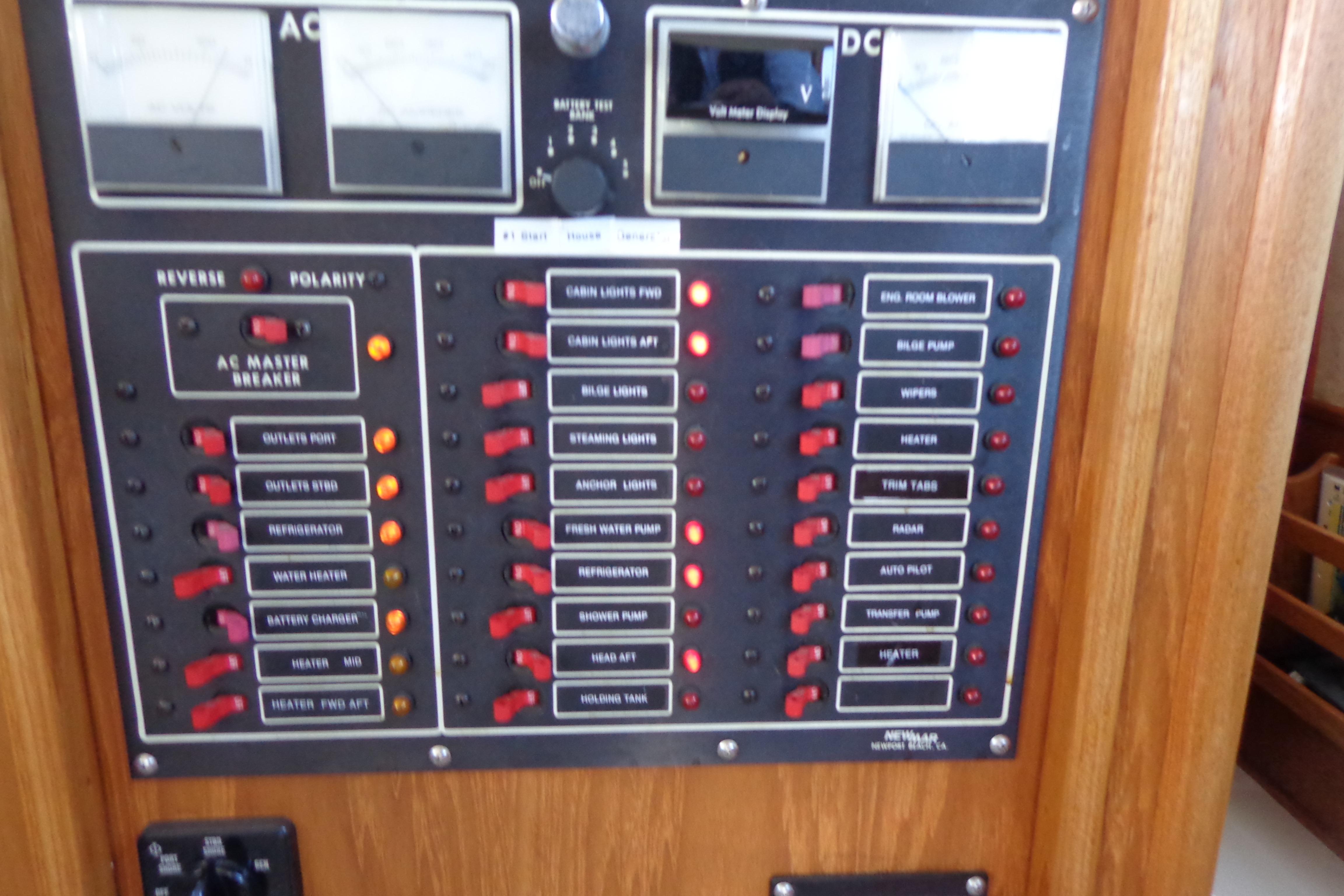 Control panel of a 1992 Cruise-A-Home Corsair 4200 boat with switches and indicators.