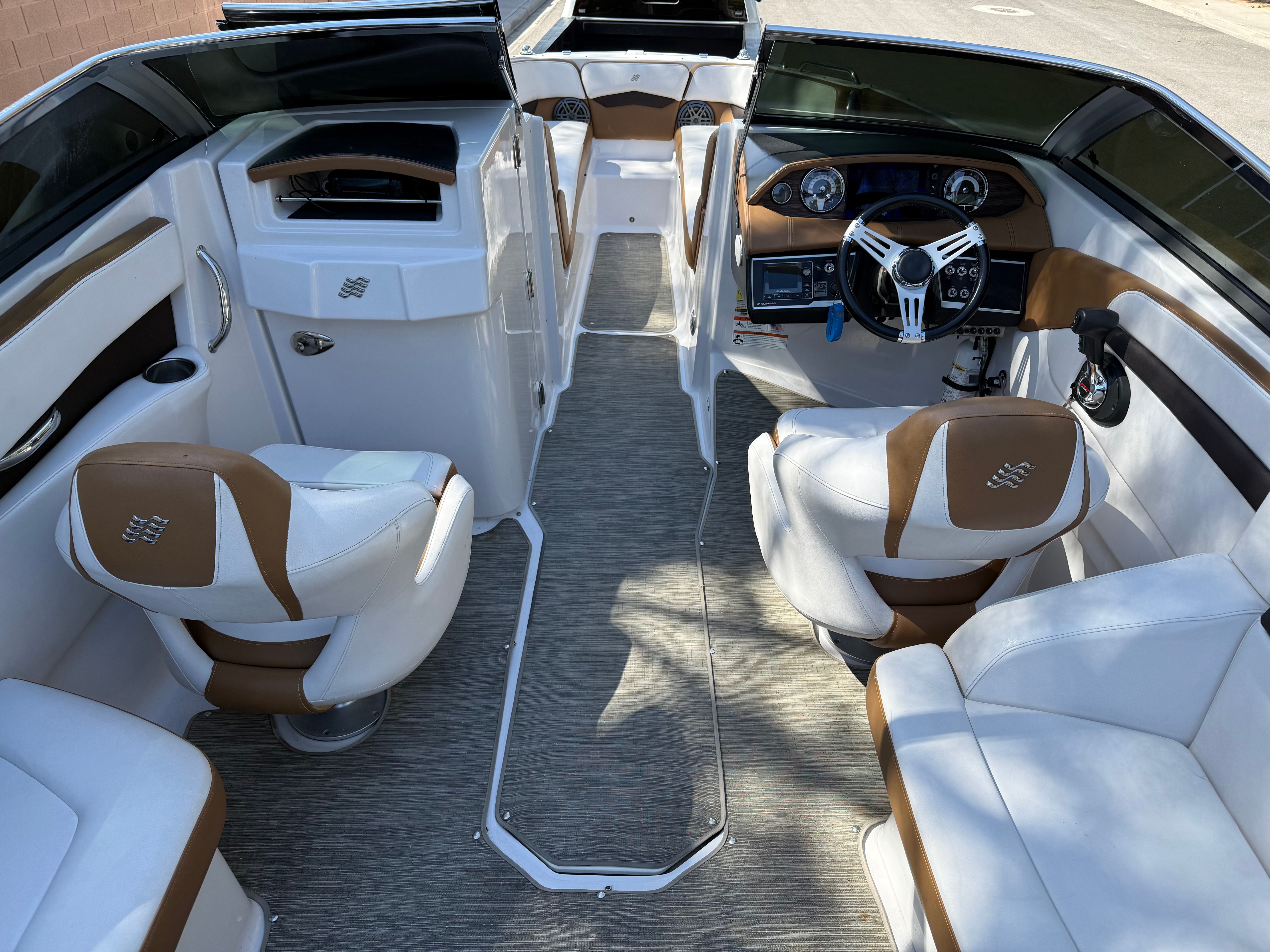 Interior of a 2019 Four Winns H260 boat with luxurious seating.