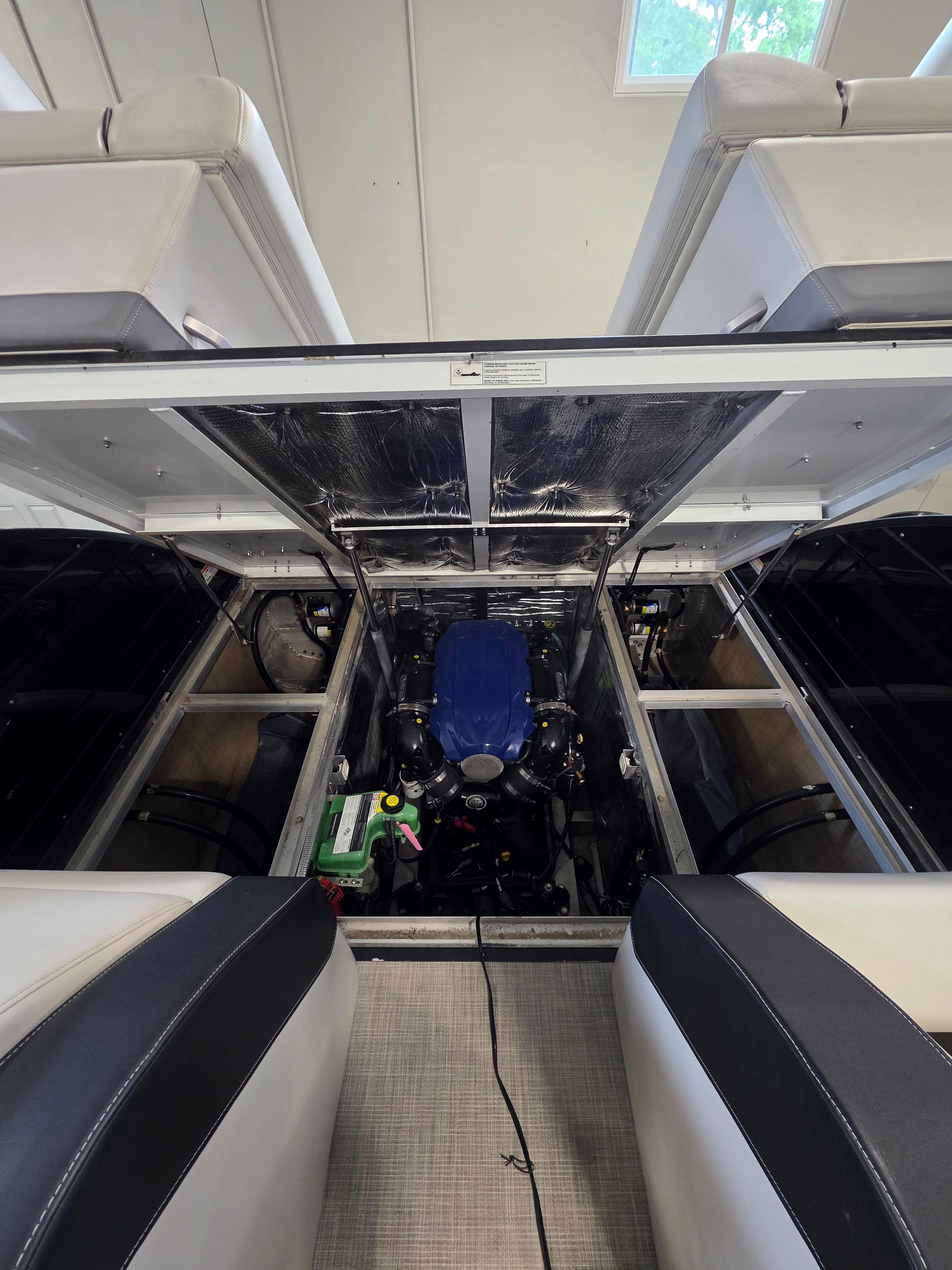 Engine compartment of 2021 Montara SURF BOSS 25 with open deck.