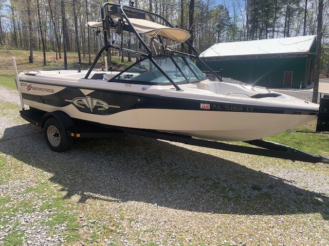 2001 Correct Craft Super Air Nautique on trailer outdoors.