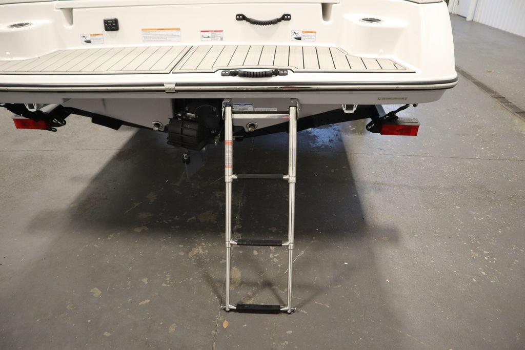 Rear view of 2026 Yamaha Boats 195S with extended swim ladder.