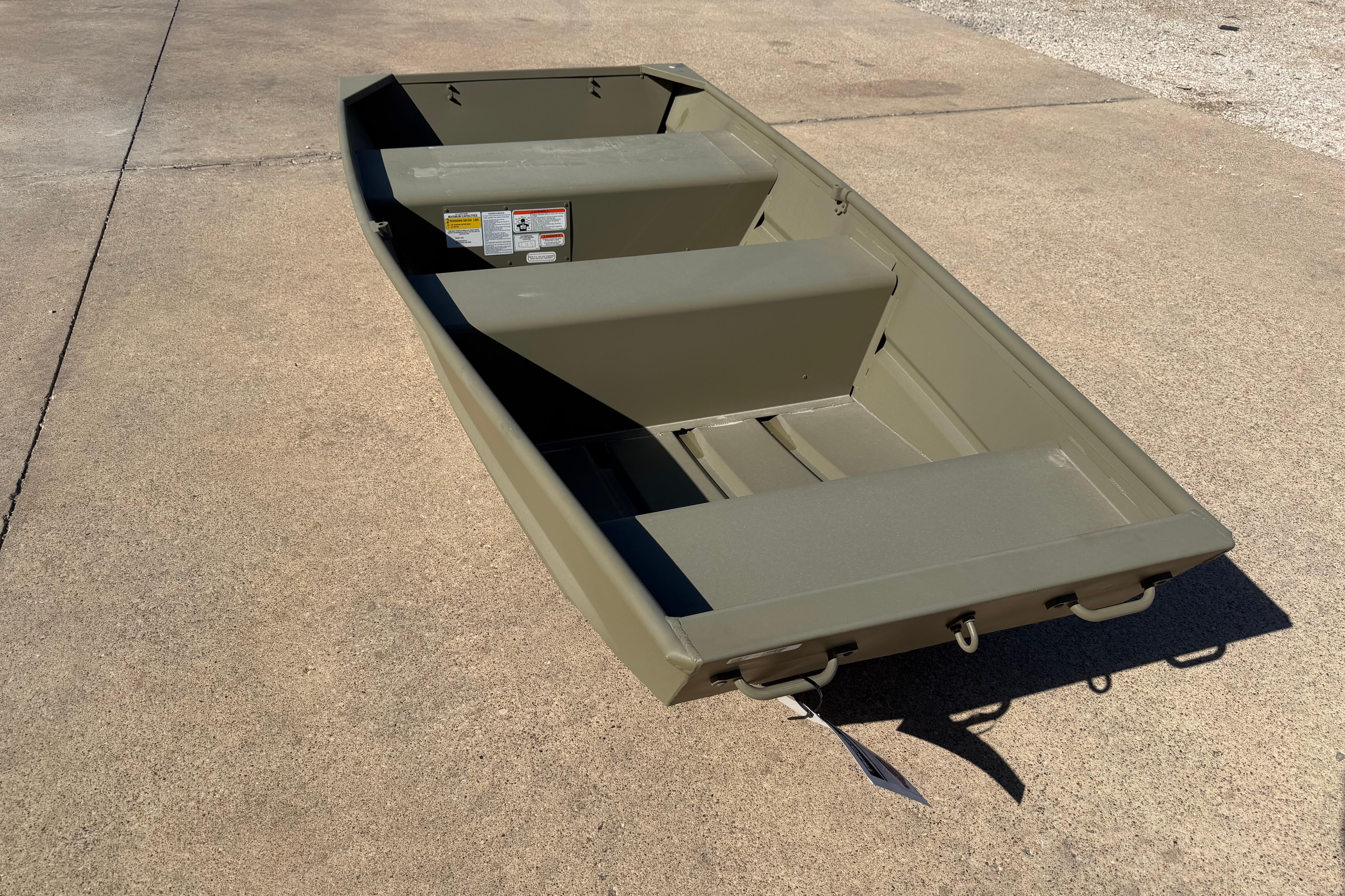 2026 Tracker Grizzly 10 Jon boat on concrete surface, showcasing its sturdy design.