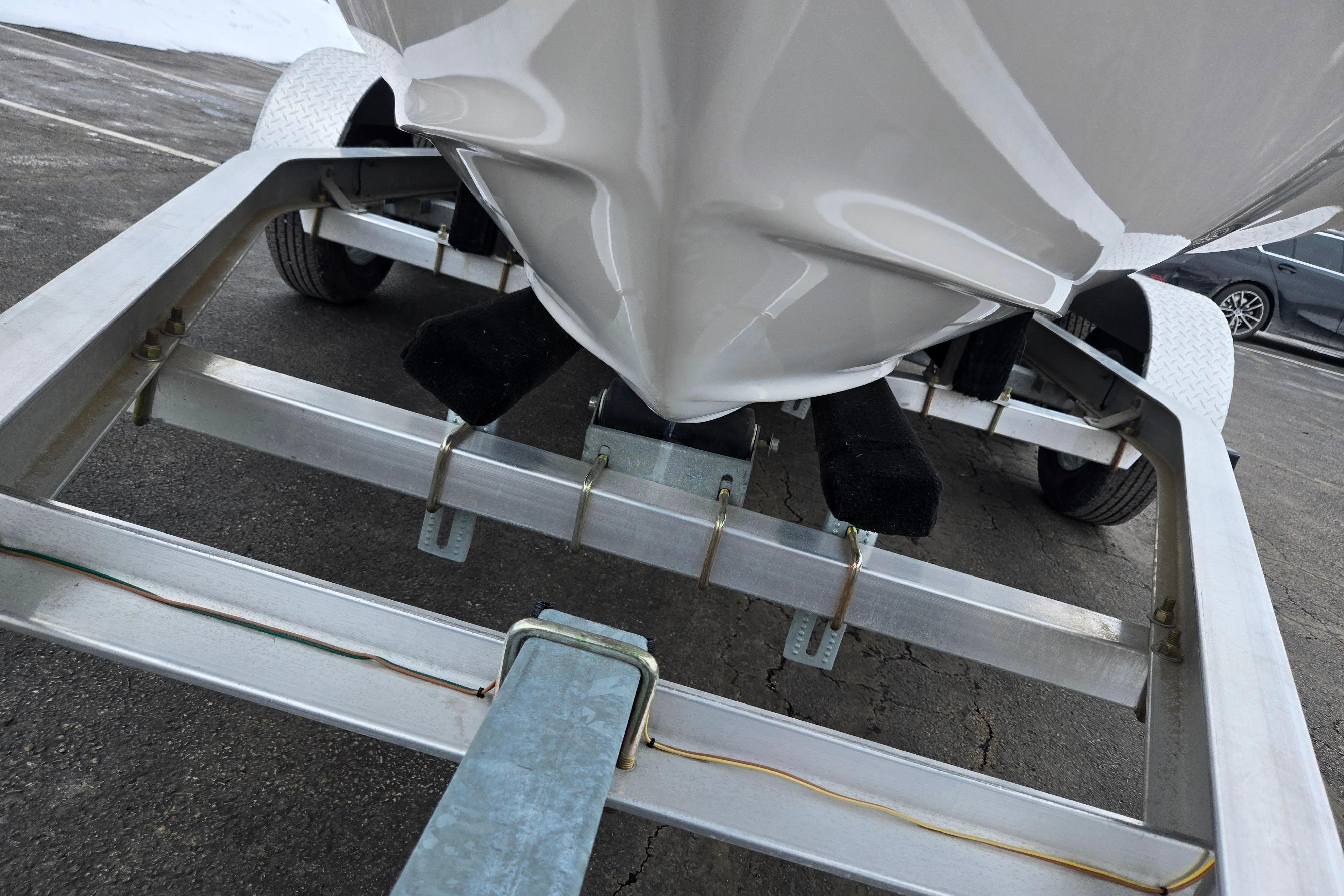 2015 Regal 1900 ES Bowrider on trailer, close-up view of hull and frame.