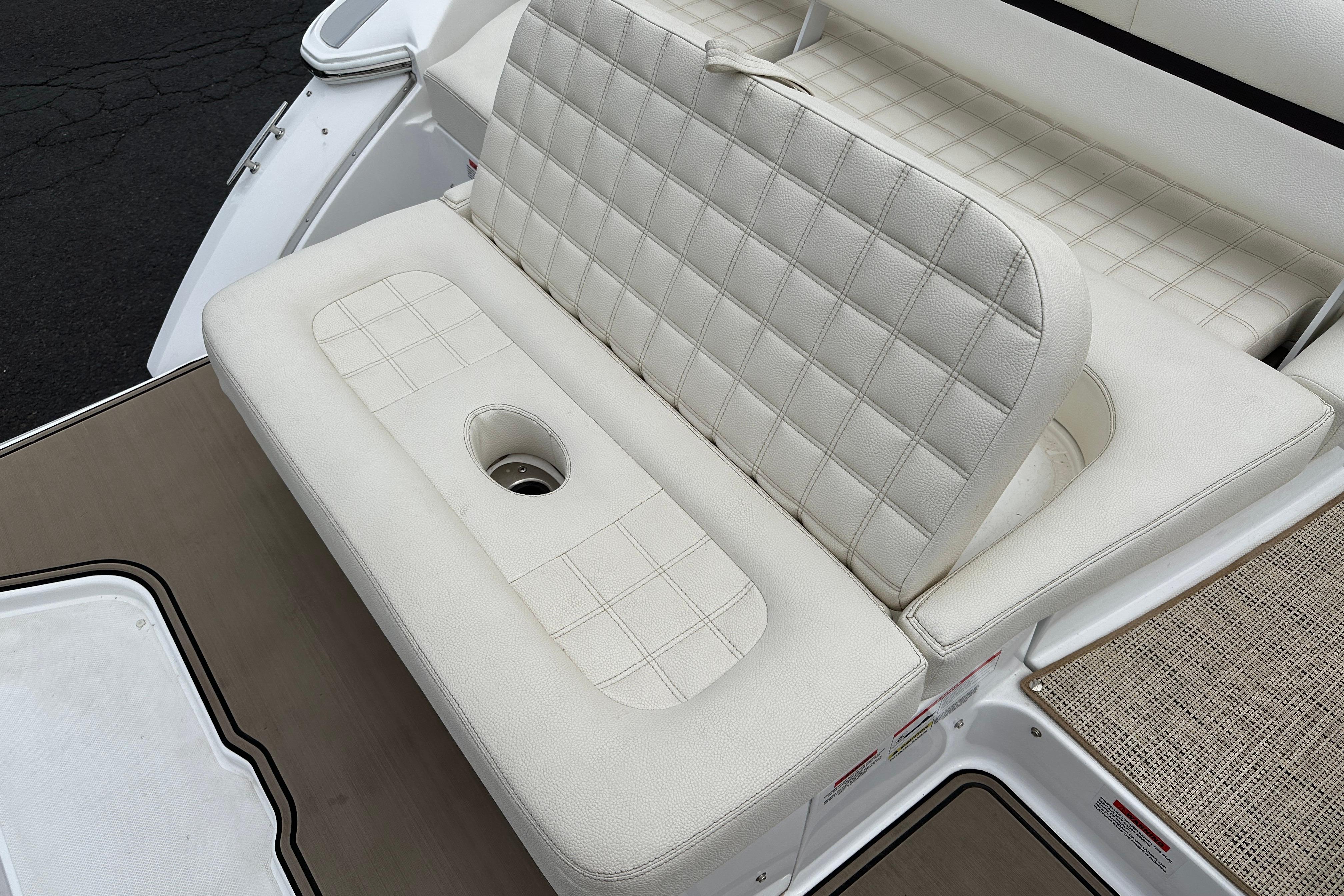 2019 Cobalt R5 boat with white cushioned seating and integrated cup holder.