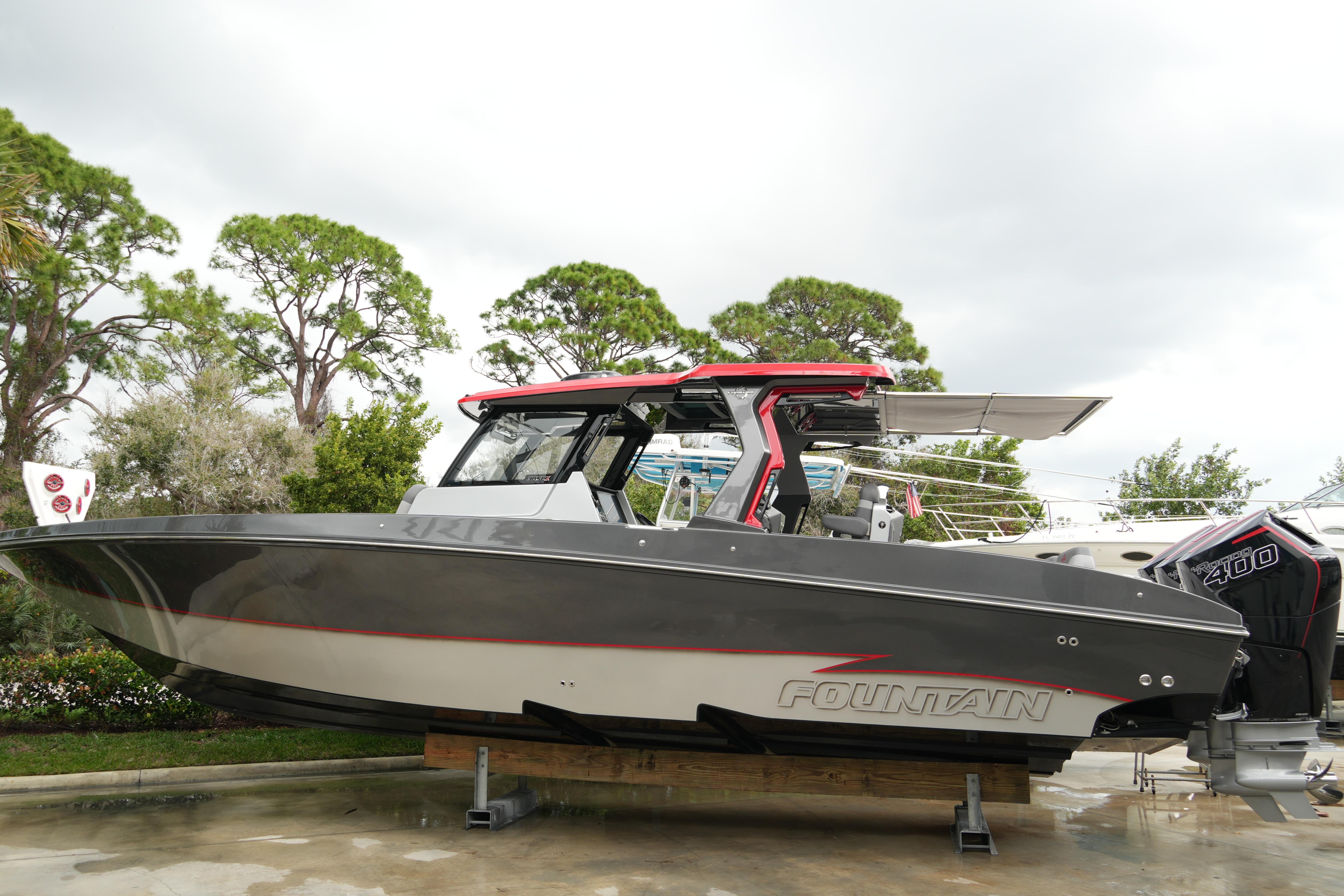 2025 Fountain 38 SCX boat with sleek design, displayed outdoors.