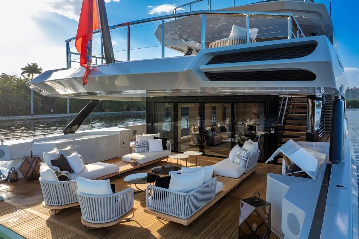 Luxurious 2024 Baglietto DOM 133 yacht with elegant outdoor seating and modern design.
