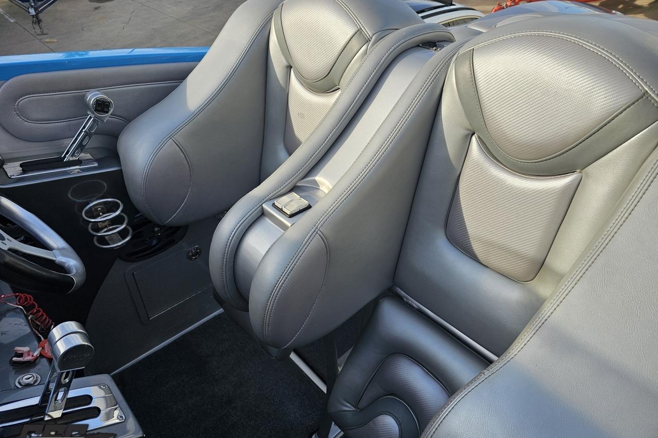 2007 Hustler 41 Razor interior with sleek gray leather seats and modern controls.