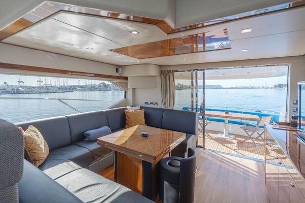 Luxurious interior of 2010 Sunseeker Manhattan 60 yacht with waterfront view.