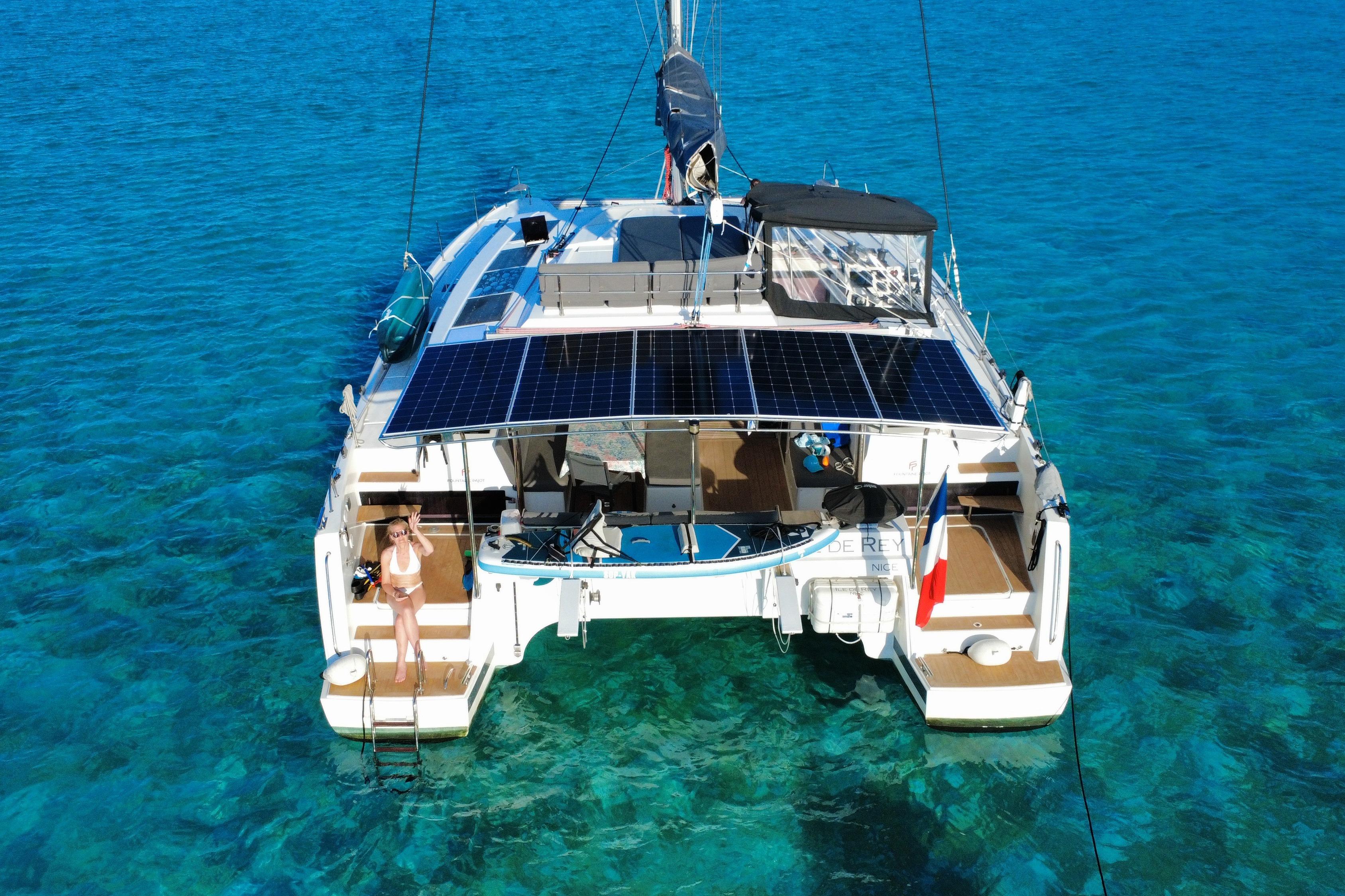 2020 Fountaine Pajot Saona 47 catamaran with solar panels on turquoise water.