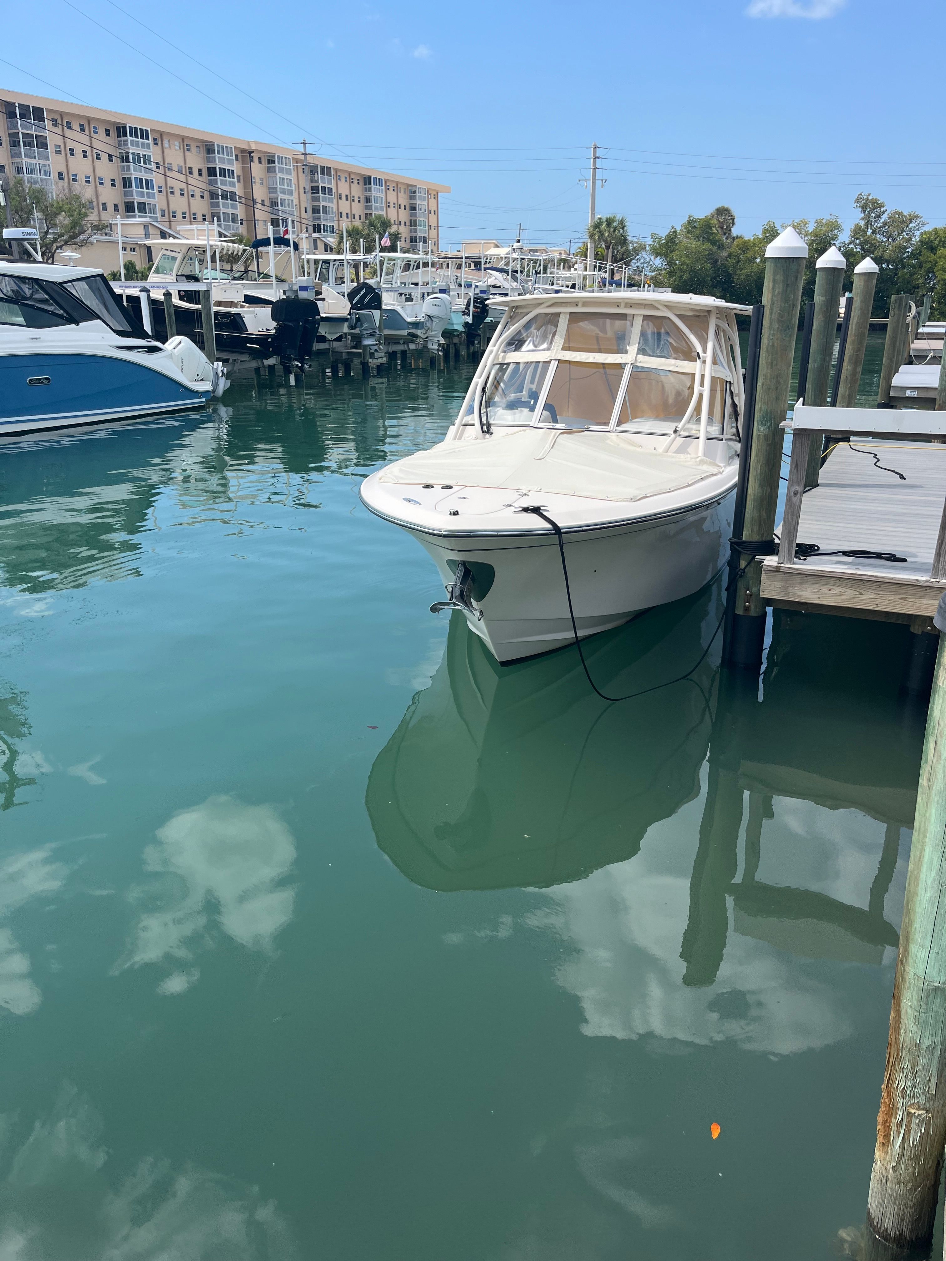 Grady-White Freedom 275 boat docked in marina, 2022 model.