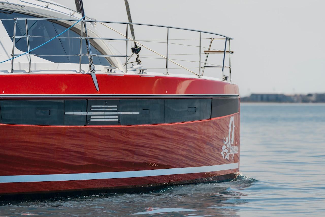 Red Privilege Signature 510 catamaran on calm water, year 2025.