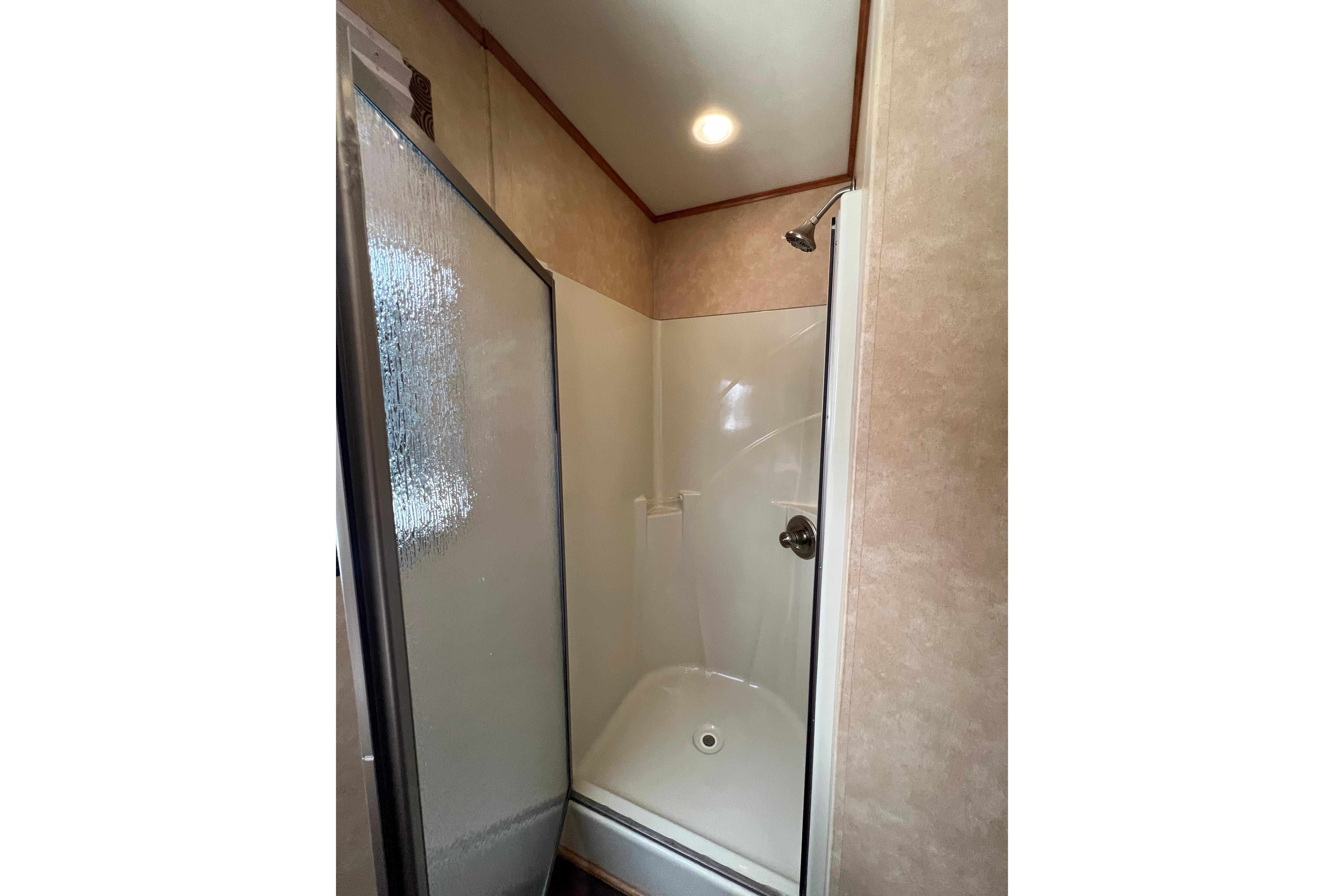 Shower area inside 2013 Destination Yacht Lotta Yachta, featuring glass door and modern fixtures.