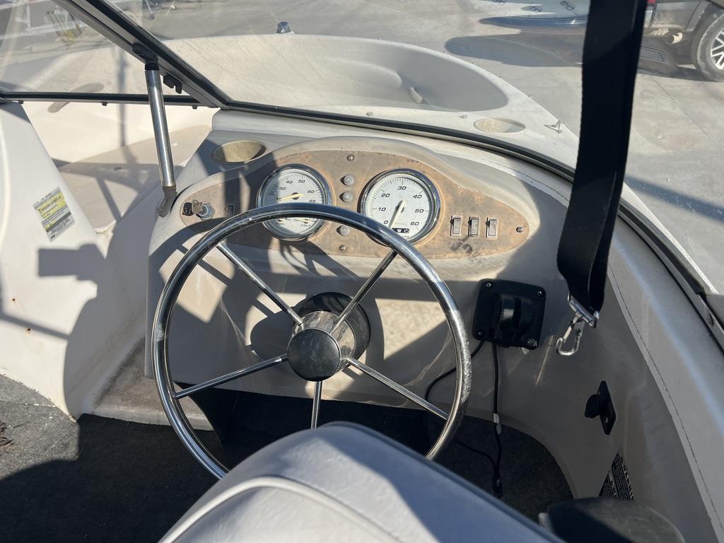 Interior view of a 2004 Bayliner 175 boat cockpit.