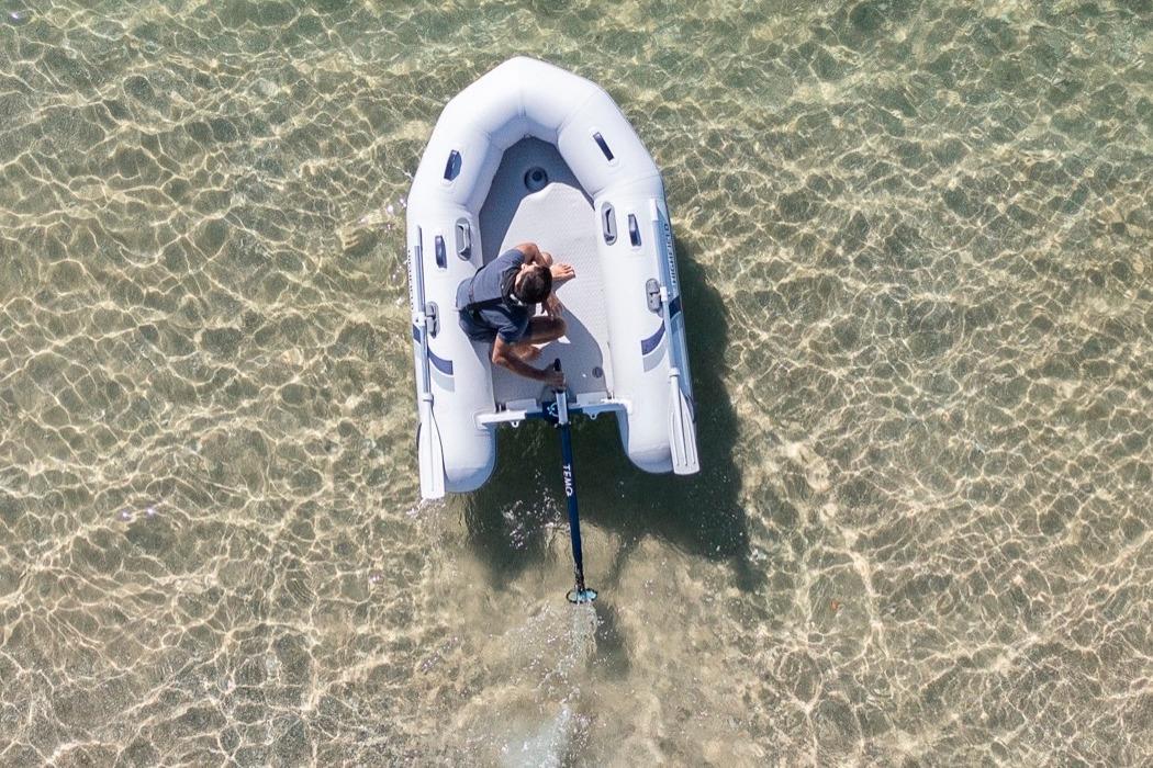Aerial view of Highfield Roll-Up 250 KAL boat in clear water.