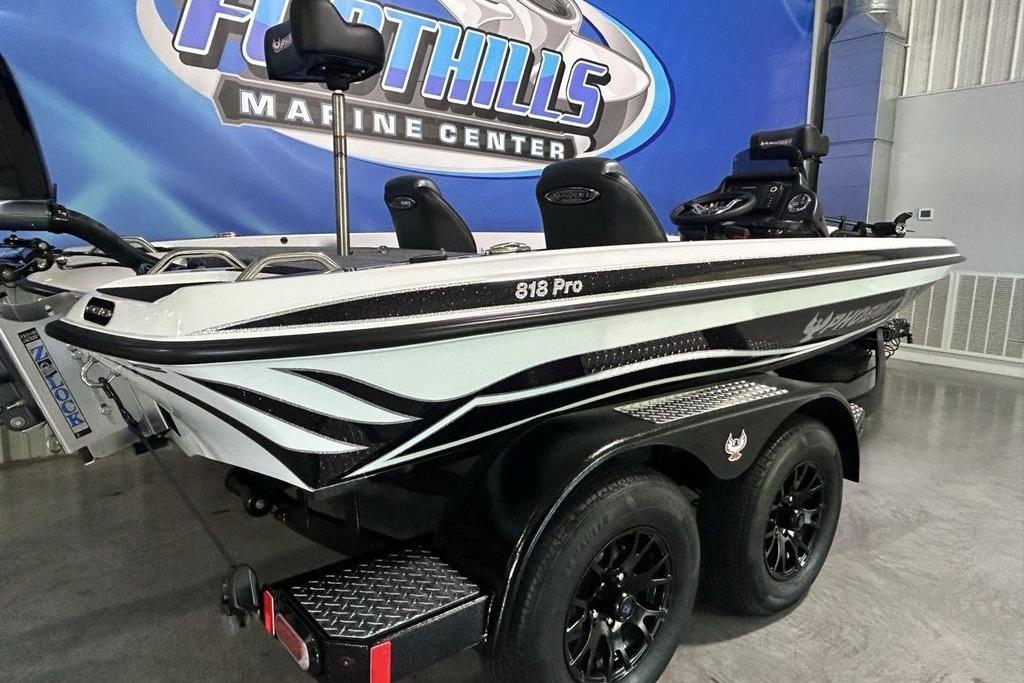 2026 Phoenix 818 Pro boat at Foothills Marine Center, featuring sleek design and dual-axle trailer.