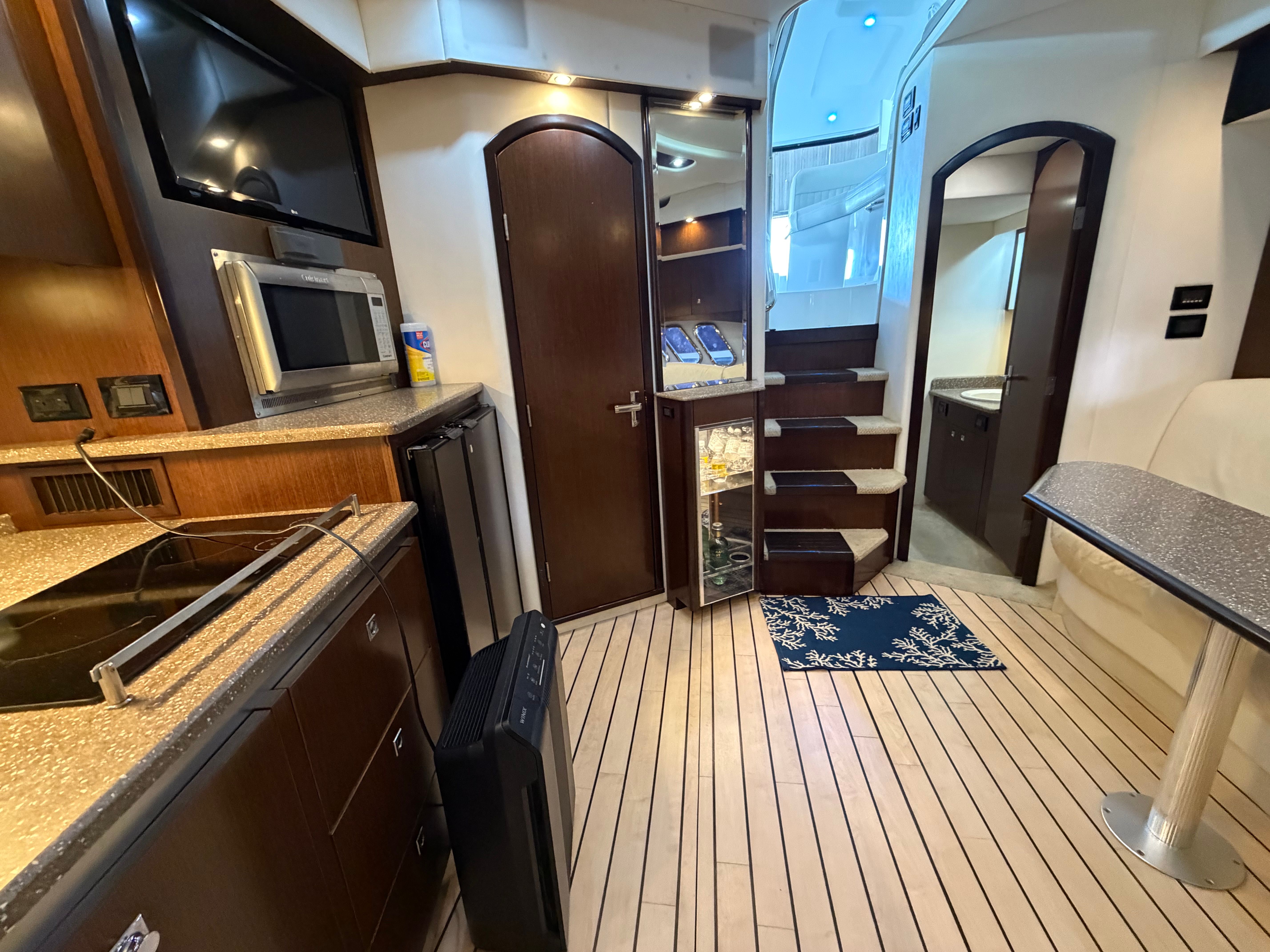Interior of 2012 Cruisers Yachts 430 Sports Coupe with modern kitchen.
